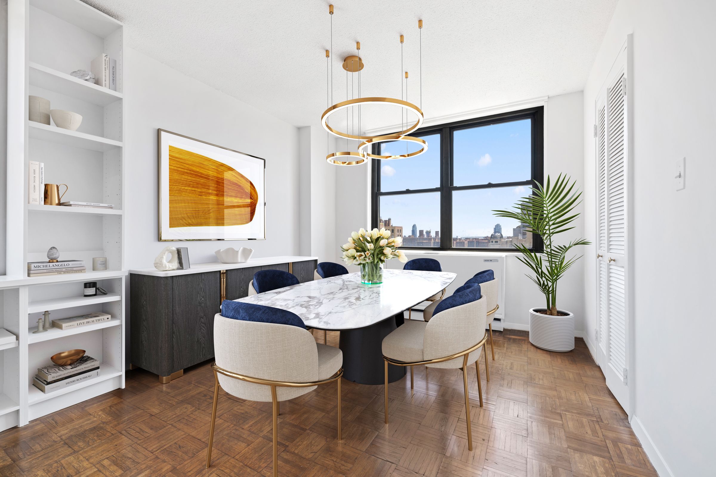 201 East 17th Street, Unit 15H Manhattan, NY 10003 - Photo 3 of 24 a view of a dining room with furniture and a potted plant