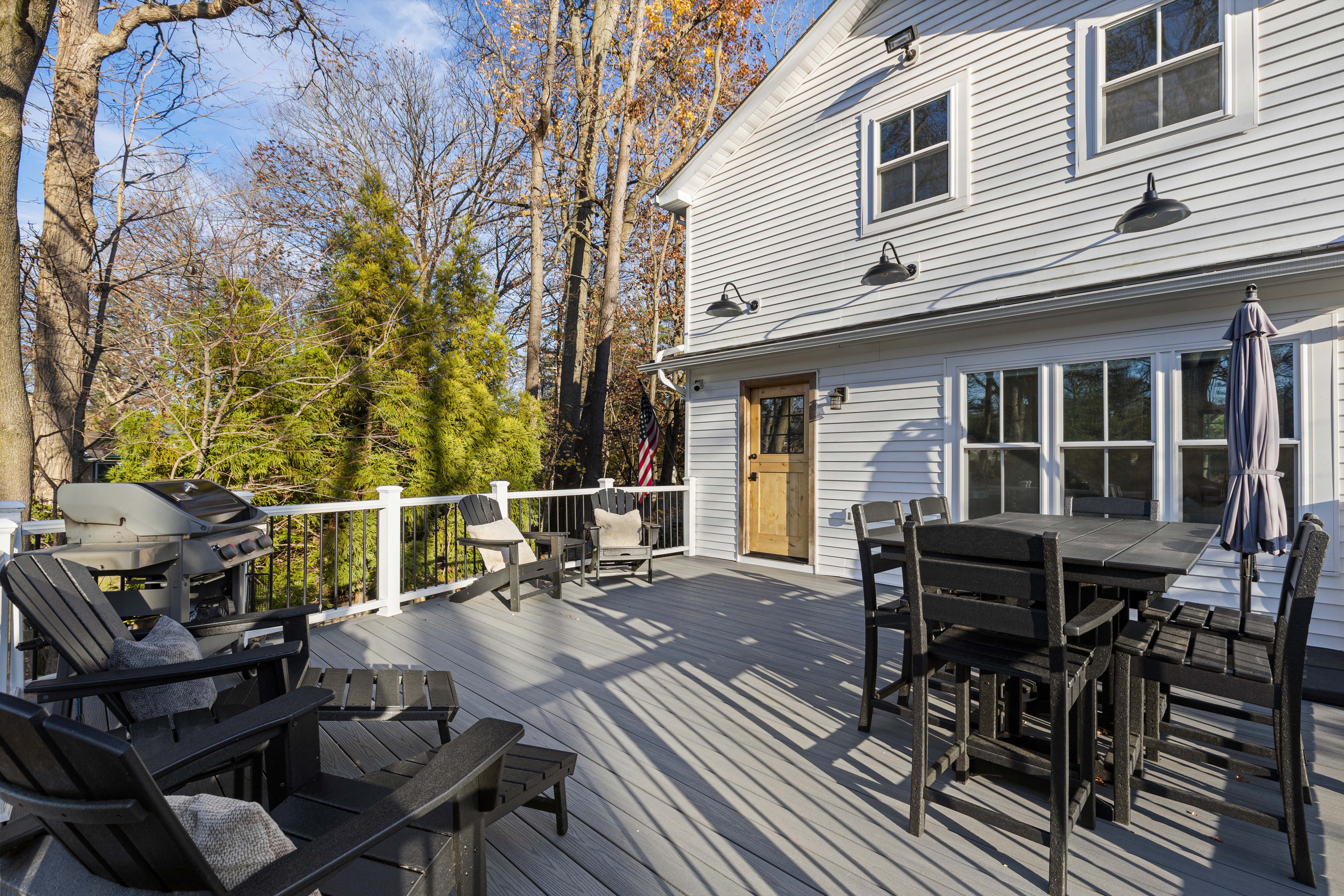 467 Midland Avenue Rye, NY 10580 - Photo 13 of 19 a view of a patio with table and chairs and wooden floor