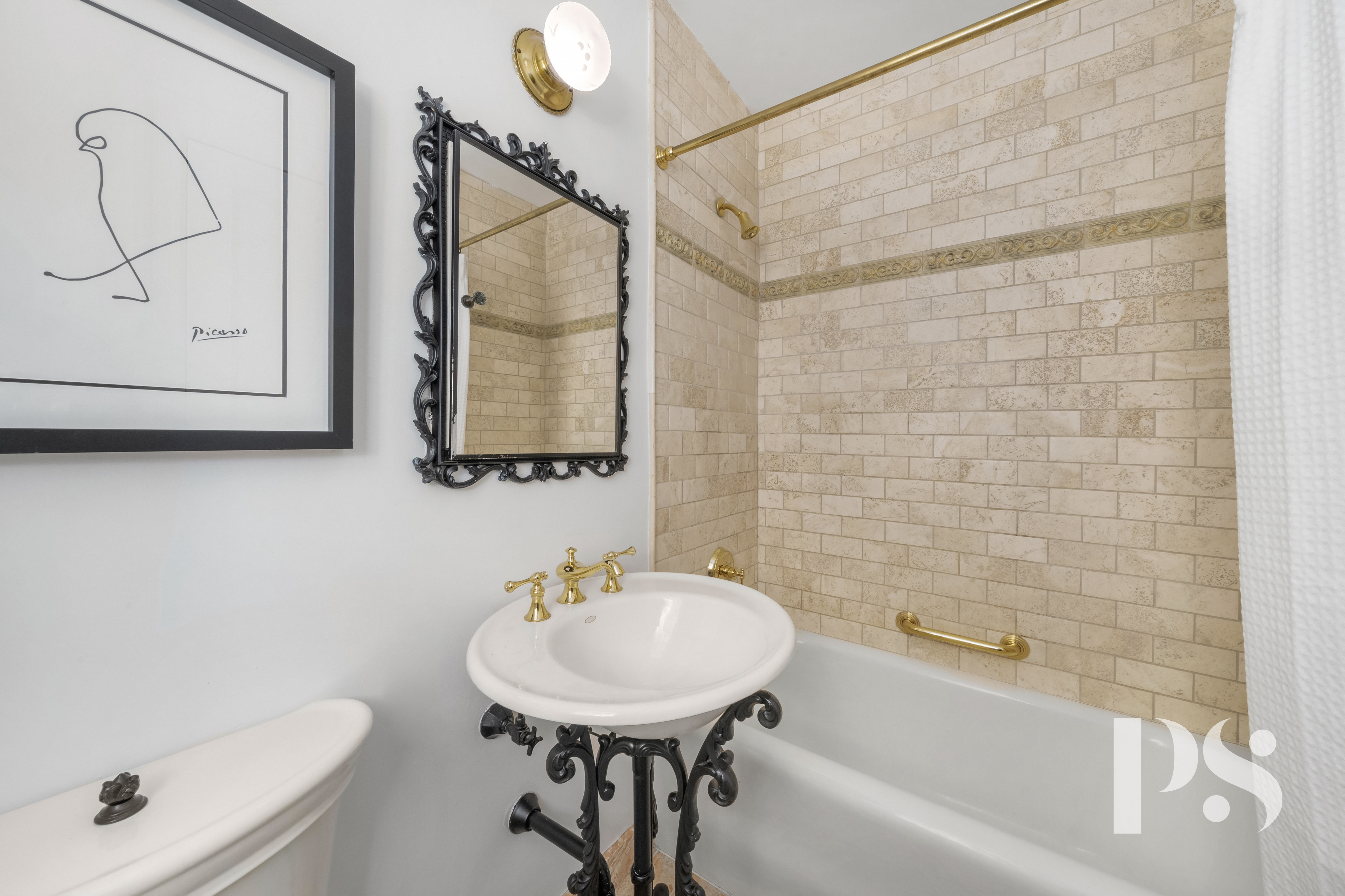35 East 9th Street, Unit 33 Manhattan, NY 10003 - Photo 11 of 14 a bathroom with a sink a toilet and bathtub