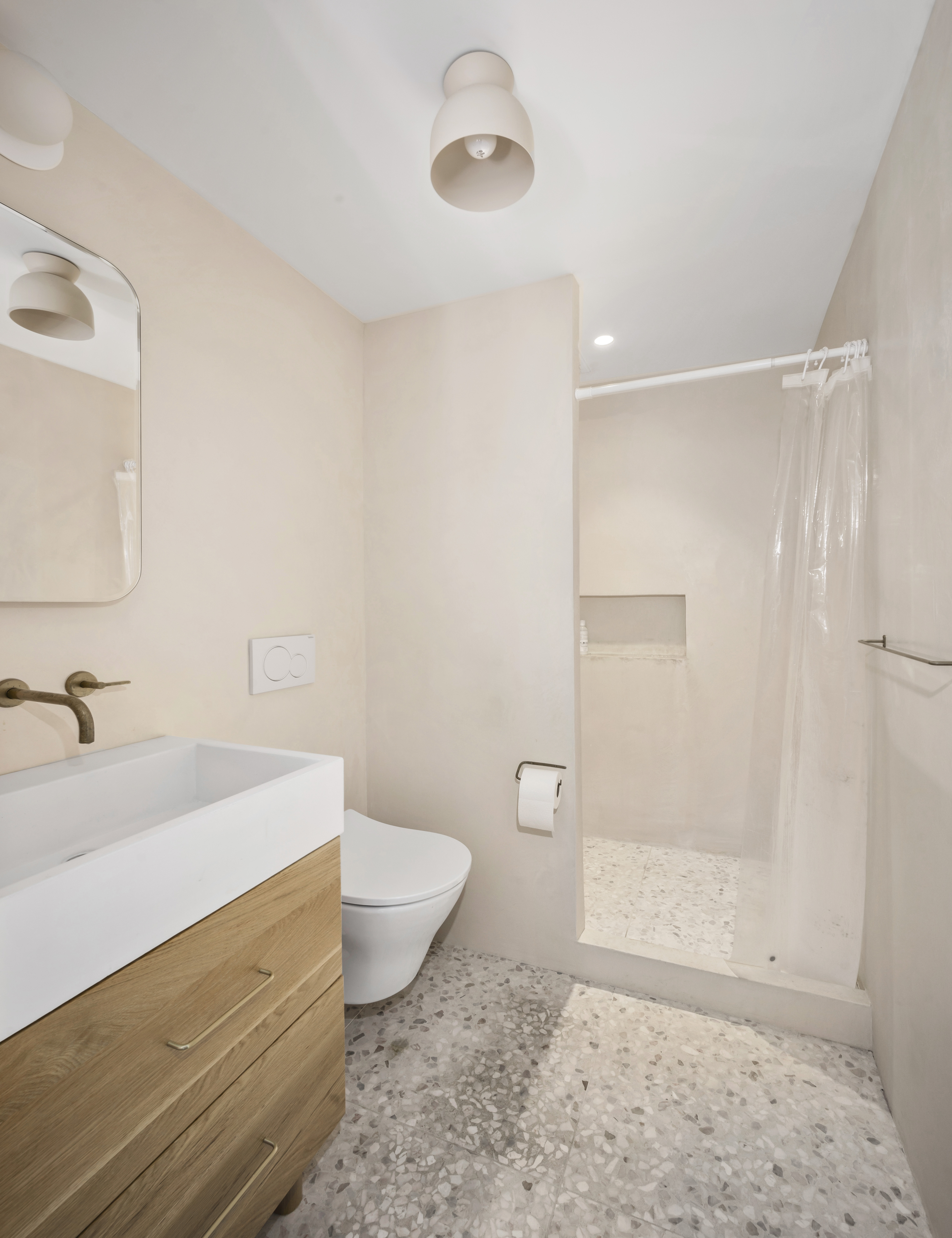 191 Spencer Street, Unit 9A Brooklyn, NY 11205 - Photo 8 of 10 a bathroom with a sink a toilet and shower