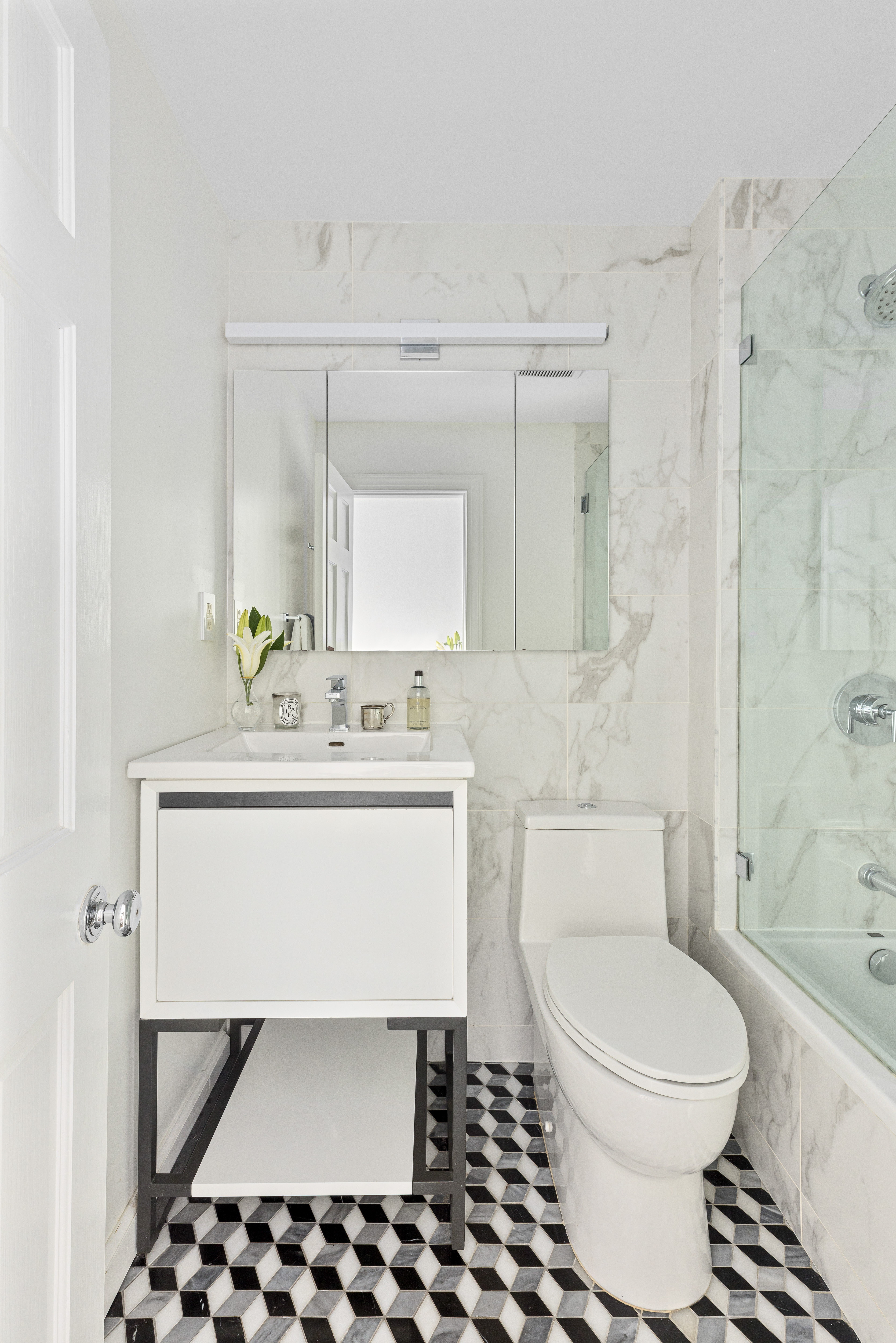 312 Hicks Street, Unit 4 Brooklyn, NY 11201 - Photo 8 of 13 a bathroom with a toilet a sink and a mirror