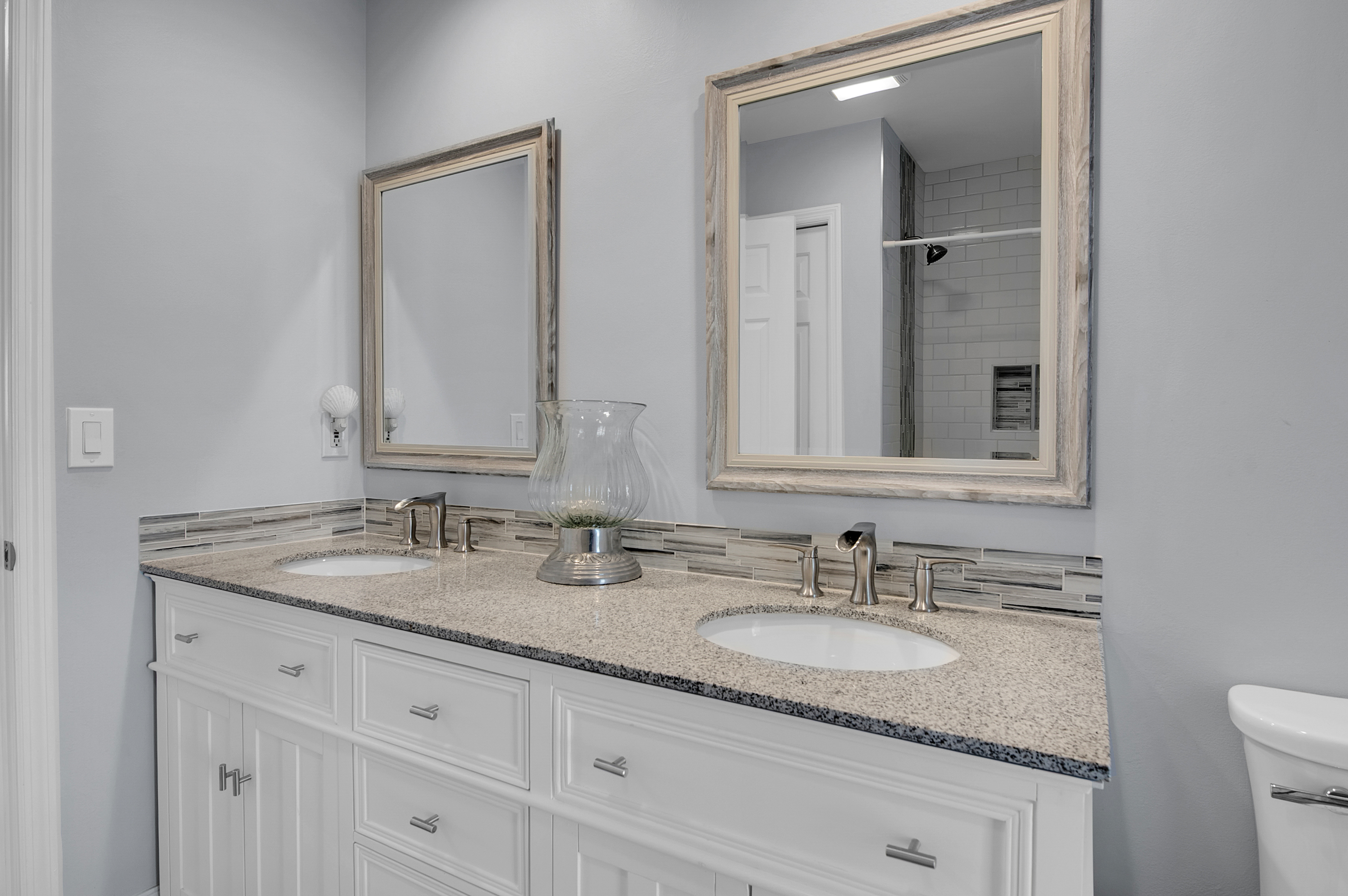 1560 Southwest 16th Street Boca Raton, FL 33486 - Photo 50 of 72 a bathroom with a granite countertop double sink and a mirror