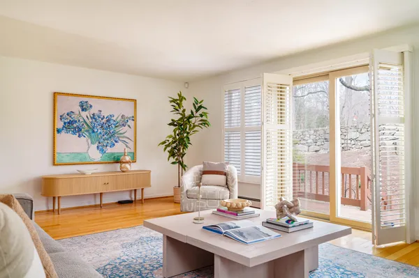 a living room with furniture and a large window