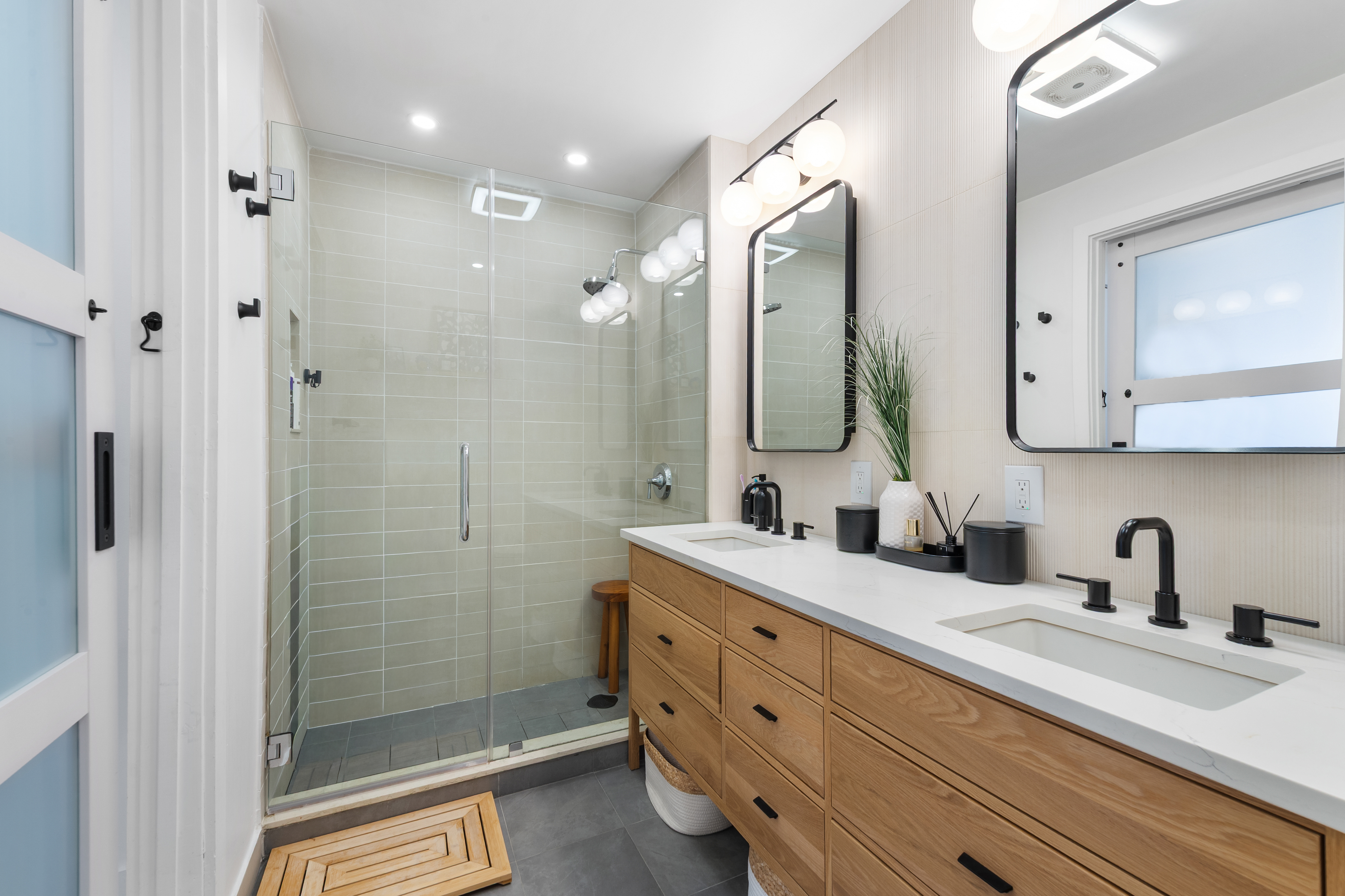 2110 Frederick Douglass Boulevard, Unit 4C Manhattan, NY 10026 - Photo 10 of 19 a bathroom with a double vanity sink mirror double and shower