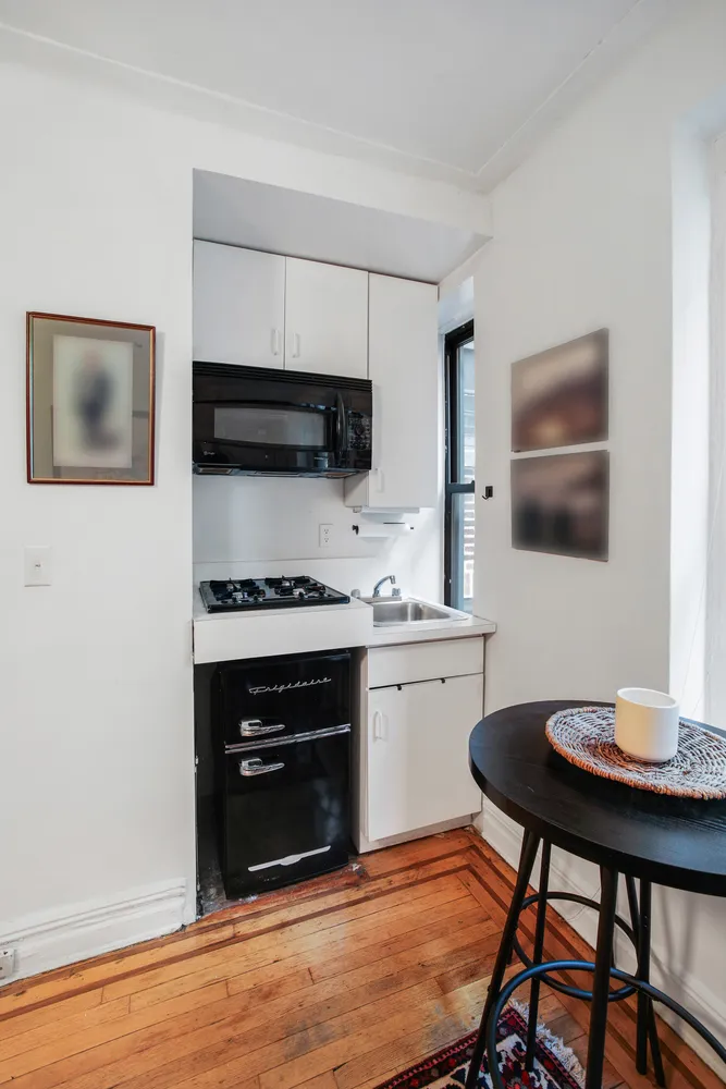 a kitchen with a stove and a microwave