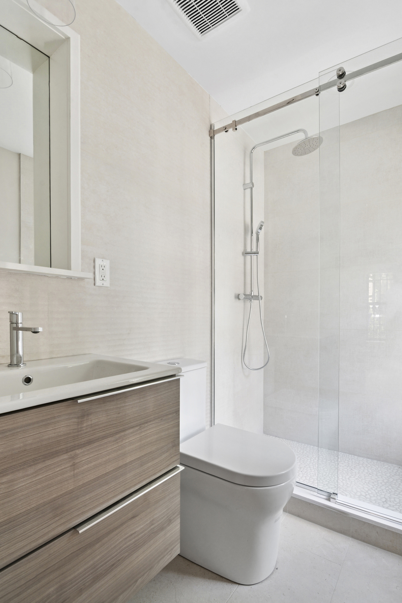 264 Stuyvesant Avenue, Unit 1 Brooklyn, NY 11221 - Photo 6 of 9 a bathroom with a shower a toilet and a sink