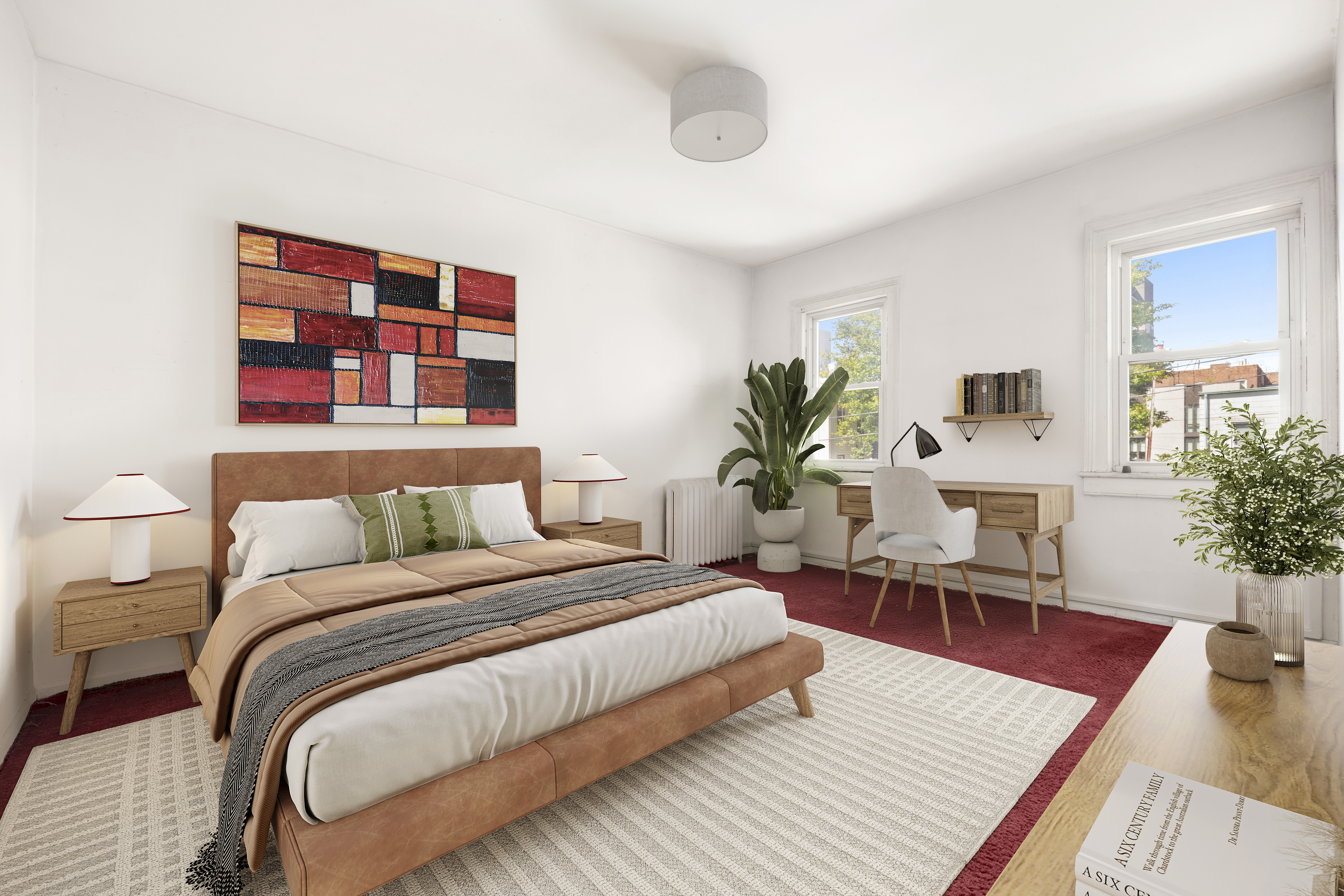 37-34 28th Street Queens, NY 11101 - Photo 13 of 17 a bedroom with a large bed a potted plant and a couch