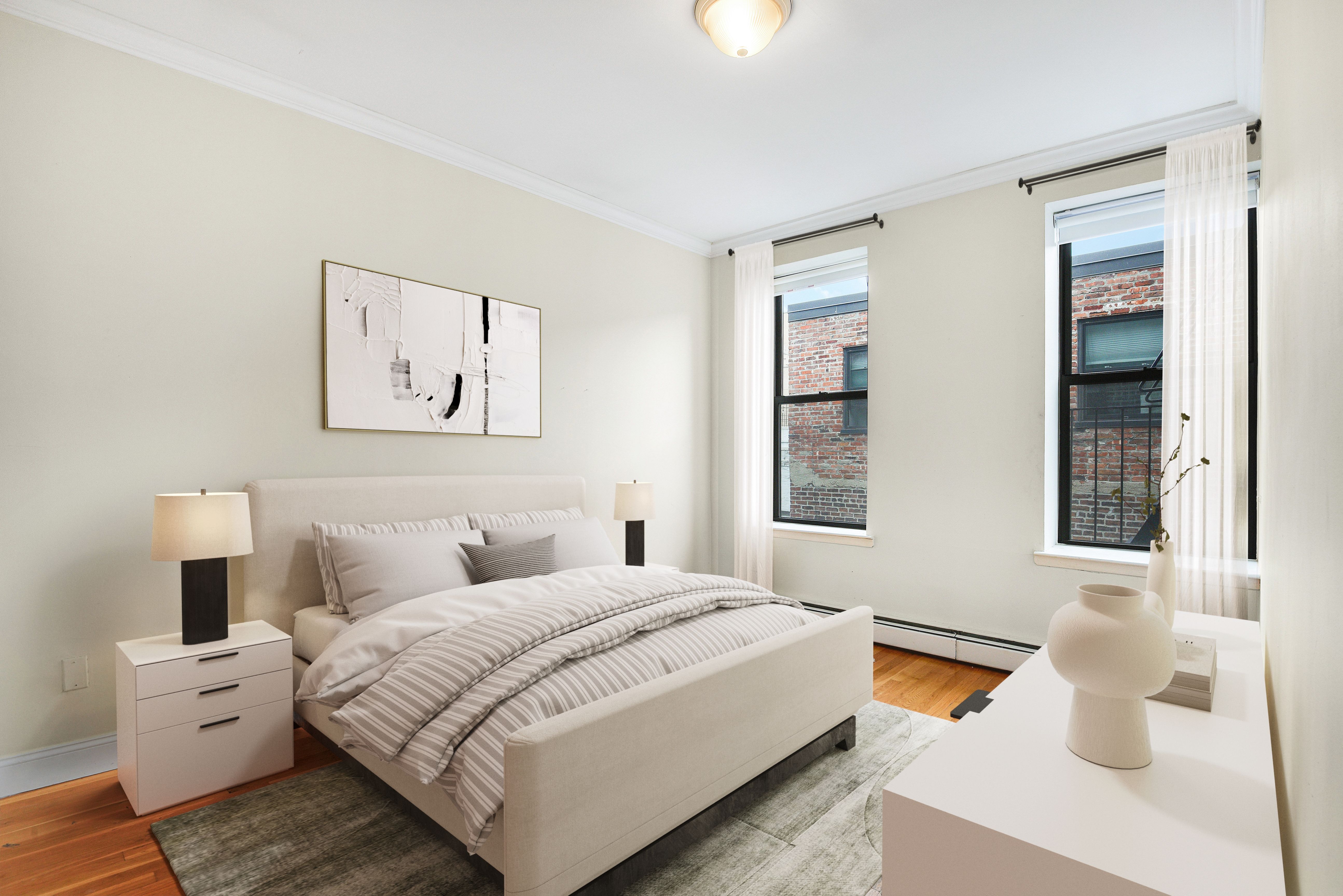 120 2nd Avenue, Unit 5A Manhattan, NY 10003 - Photo 5 of 10 a bedroom with a bed and a couch