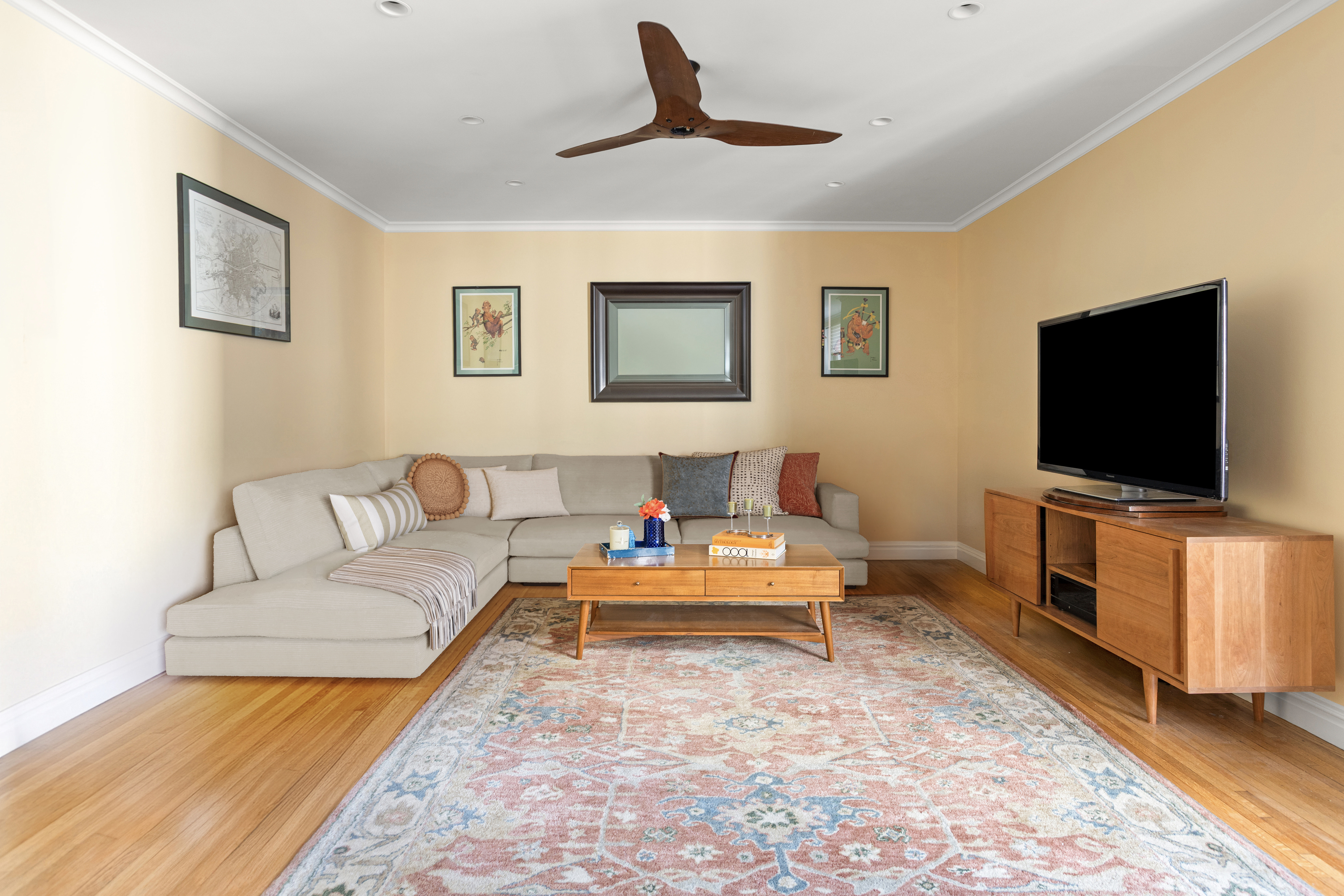 161 East 90th Street, Unit 5C Manhattan, NY 10128 - Photo 5 of 14 a living room with furniture and a flat screen tv