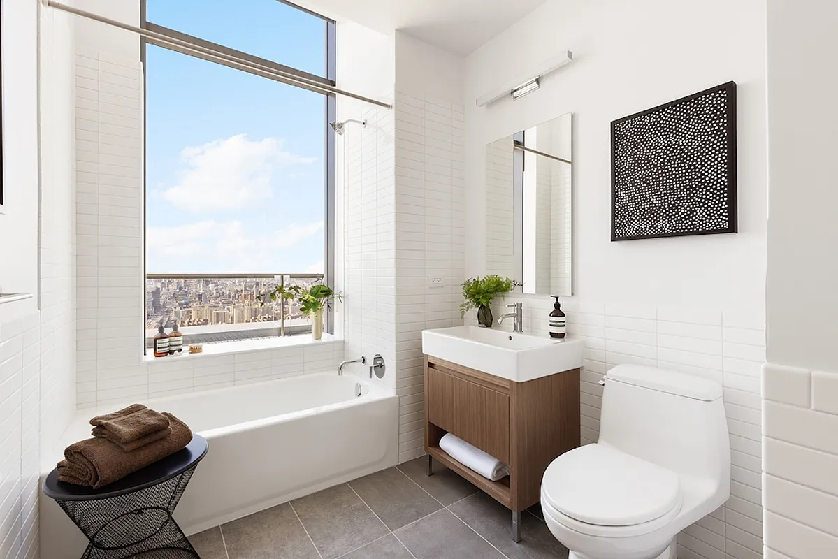 5 South 5th Street, Unit PH2B Brooklyn, NY 11249 - Photo 10 of 27 a bathroom with a toilet a sink and a bathtub