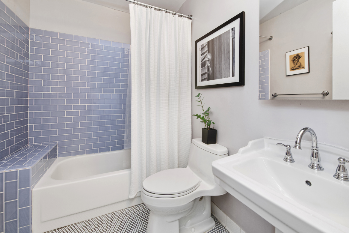 72 East 3rd Street, Unit 5A Manhattan, NY 10003 - Photo 9 of 16 a bathroom with a toilet a sink and bathtub