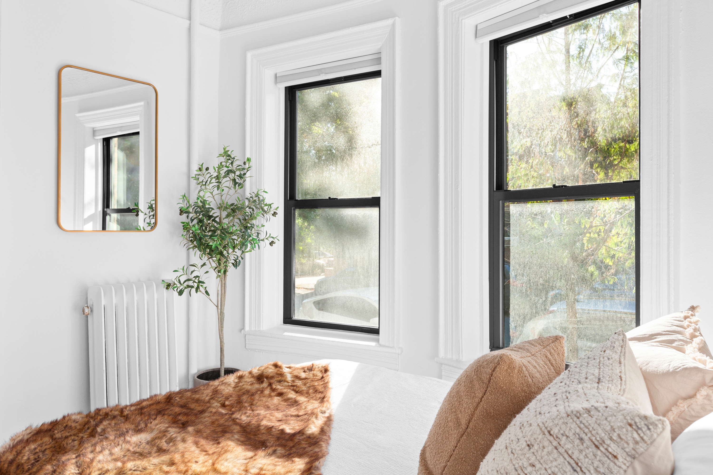 47 Reeve Place, Unit 1 Brooklyn, NY 11218 - Photo 5 of 8 a bedroom with a bed and a window