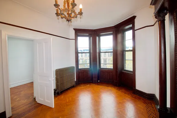 a view of room with window and hardwood floor