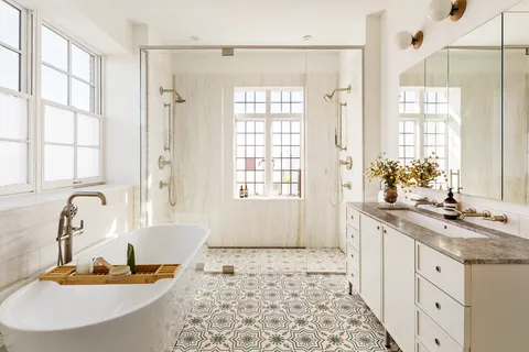 a bedroom with two beds and a window