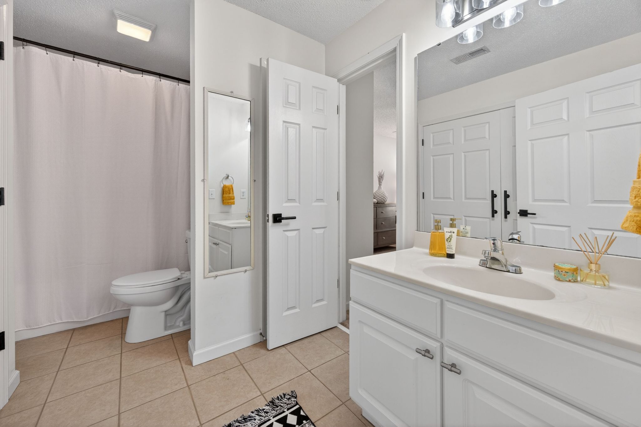 Huntscroft Lane Raleigh, NC 27617 - Photo 46 of 49 a bathroom with a sink a toilet and a shower