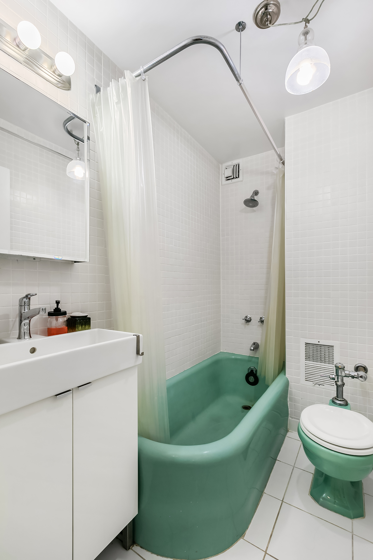 7 Park Avenue, Unit 7J Manhattan, NY 10016 - Photo 5 of 8 a bathroom with a sink a bathtub and a shower
