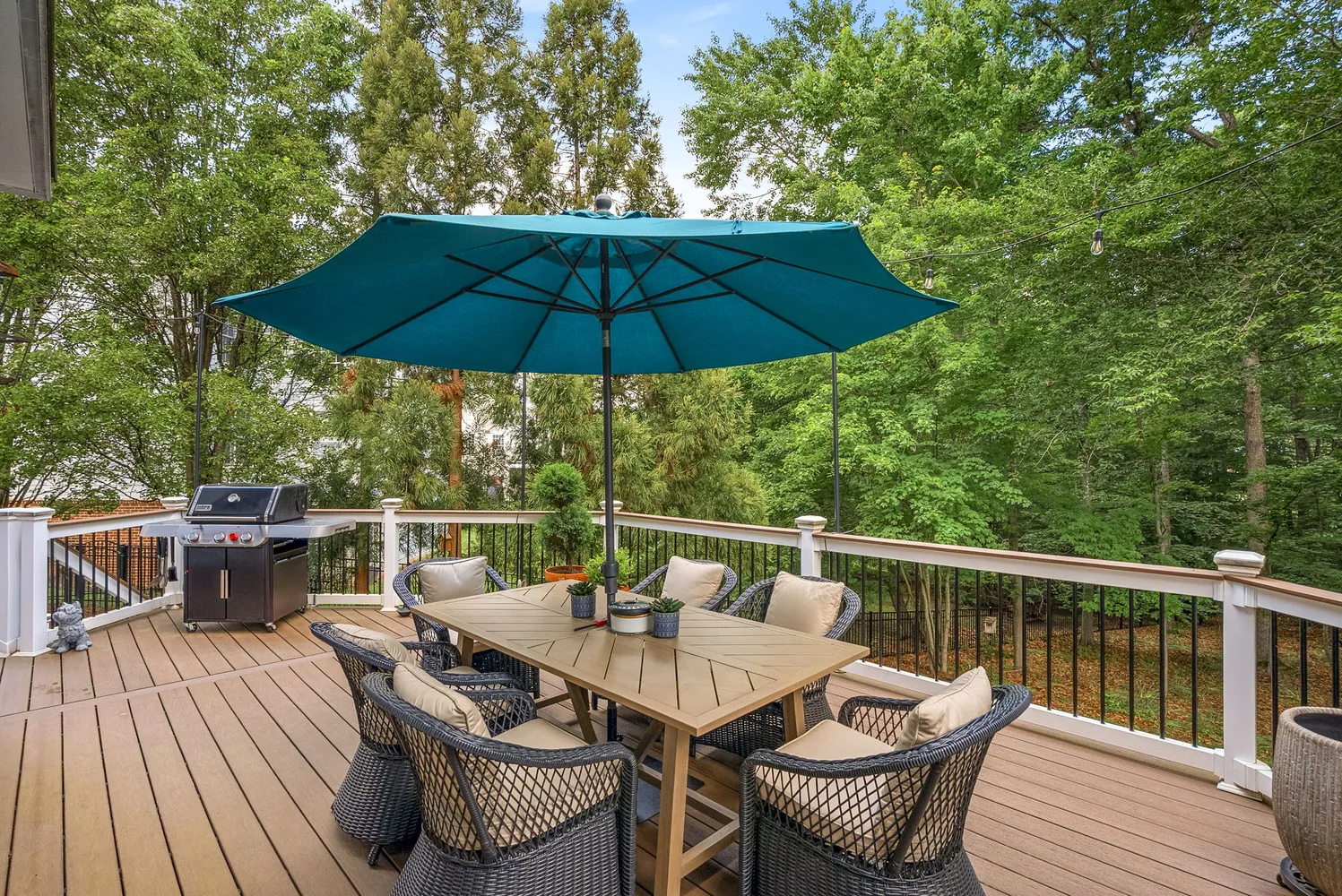 a view of balcony with furniture and umbrella