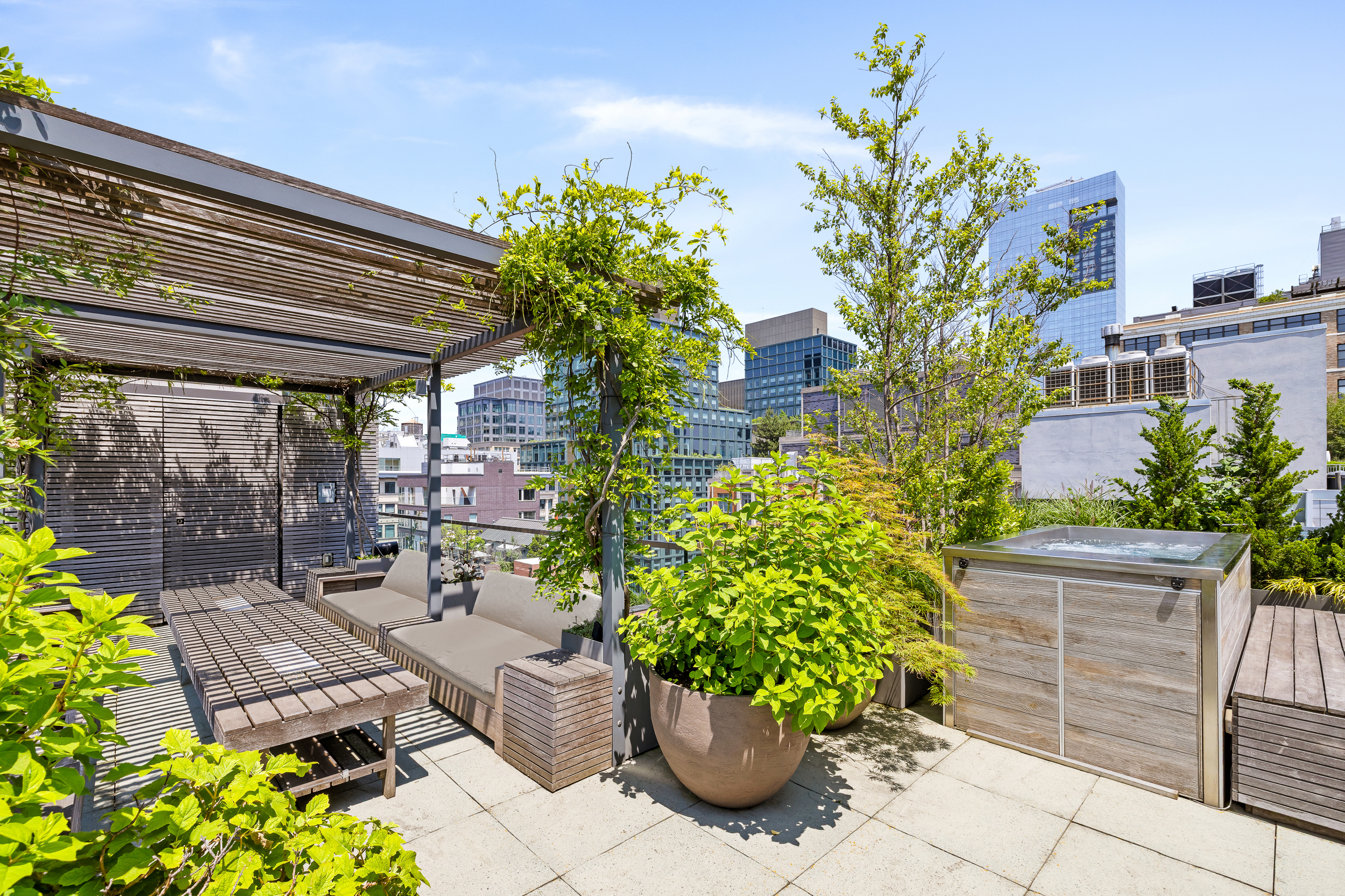 15 Renwick Street, Unit PH2 Manhattan, NY 10013 - Photo 1 of 23 a view of a backyard with plants and a patio
