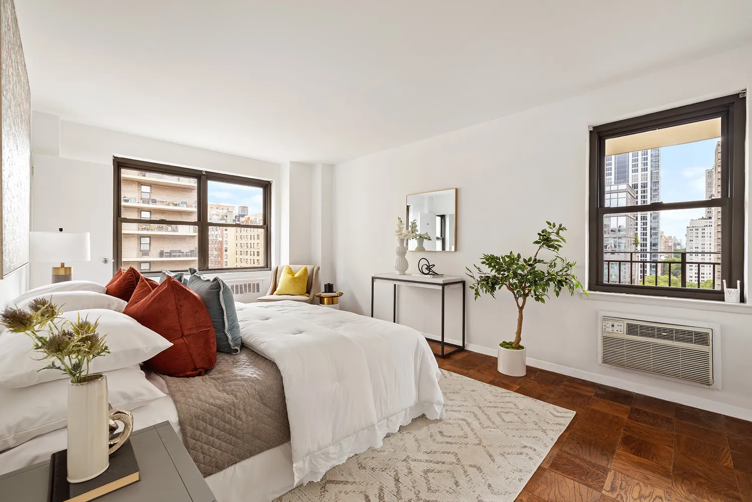 a bedroom with a bed and glass windows