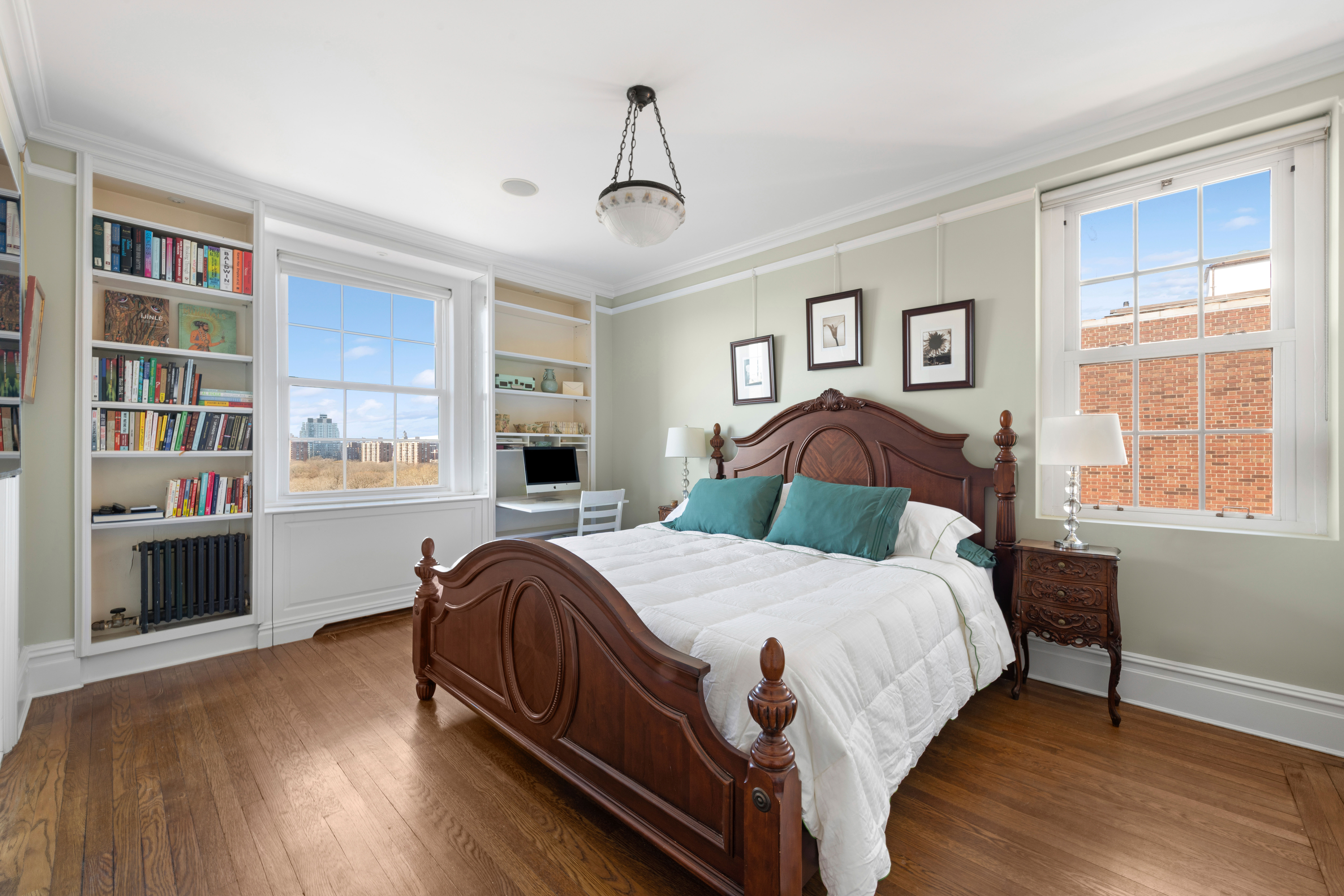 1140 5th Avenue, Unit 14B Manhattan, NY 10128 - Photo 7 of 18 a bedroom with a bed and a large window
