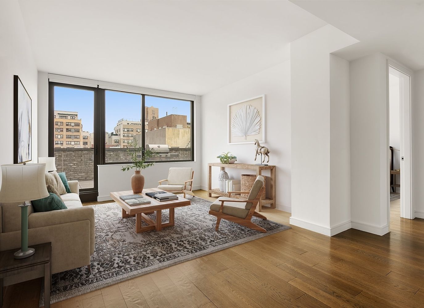 a living room with furniture and large windows