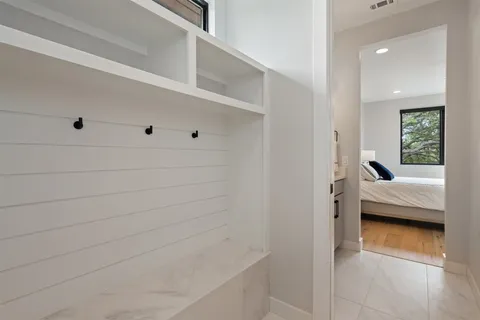 a spacious bedroom with a bed and a table