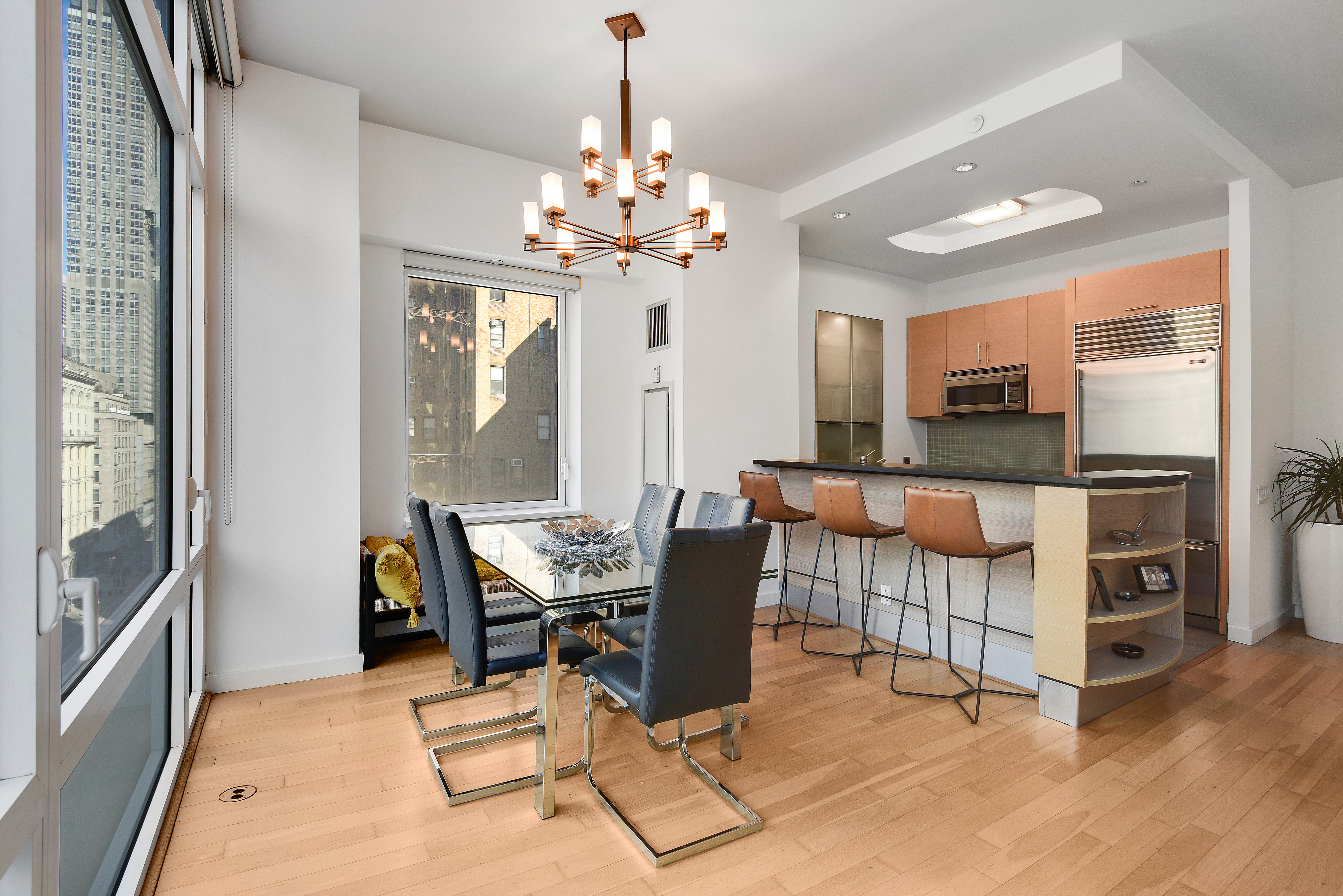 325 5th Avenue, Unit 16C Manhattan, NY 10016 - Photo 2 of 25 a dining room with furniture a chandelier and window