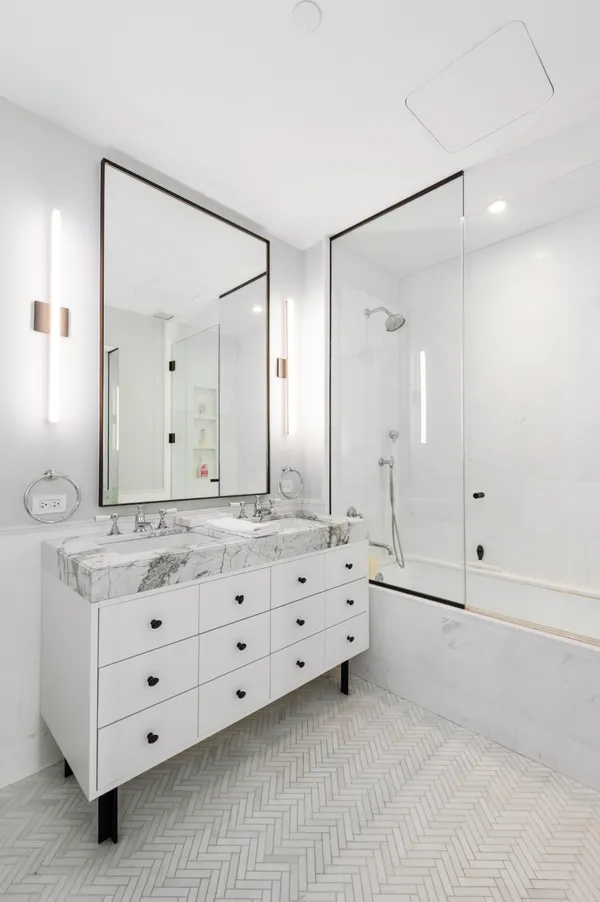 a bathroom with a granite countertop sink mirror and double