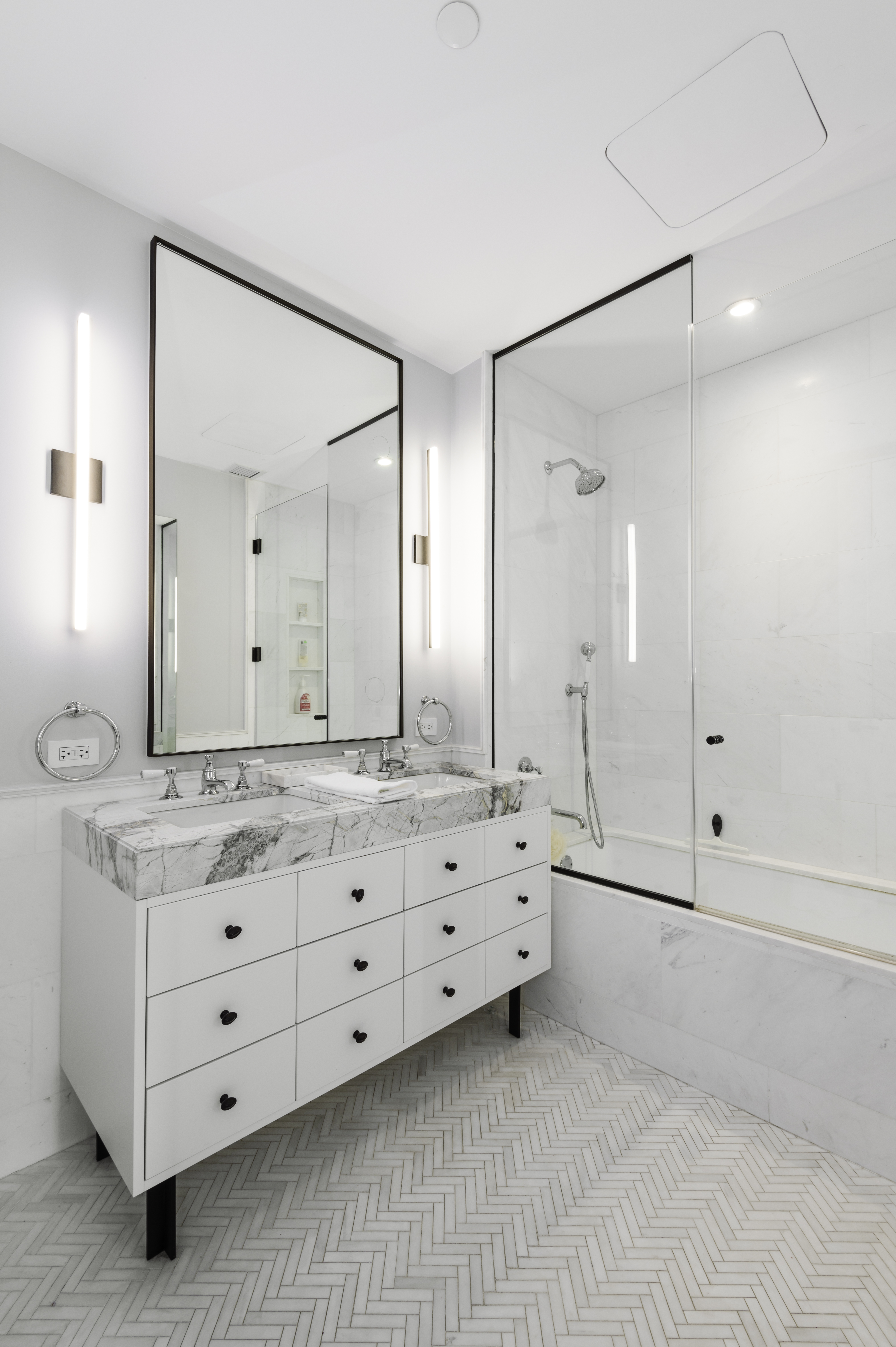 438 East 12th Street, Unit 6J Manhattan, NY 10009 - Photo 4 of 14 a bathroom with a granite countertop sink mirror and double
