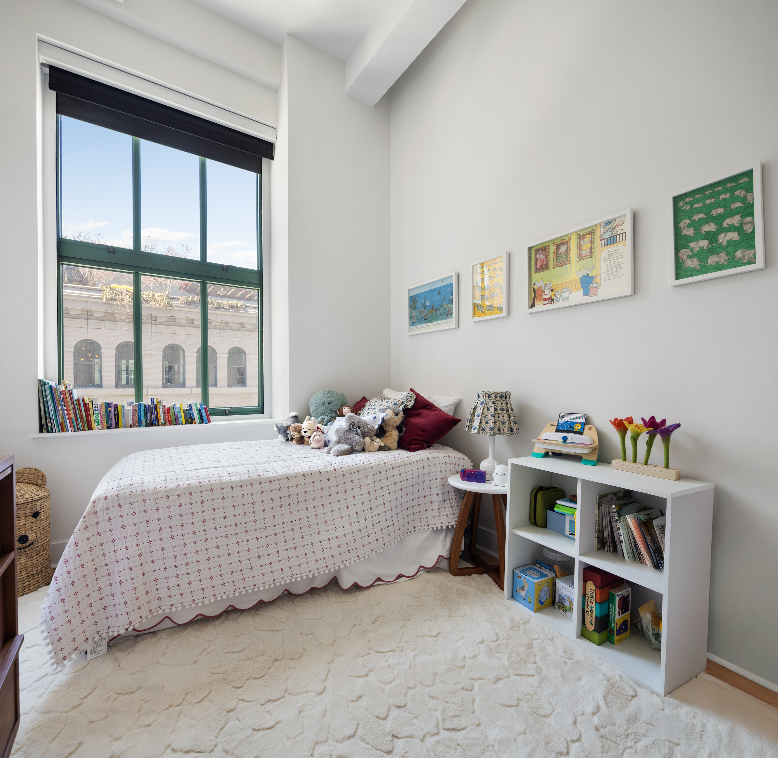 415 Greenwich Street, Unit 5D Manhattan, NY 10013 - Photo 8 of 16 a bed sitting in a bedroom next to a window