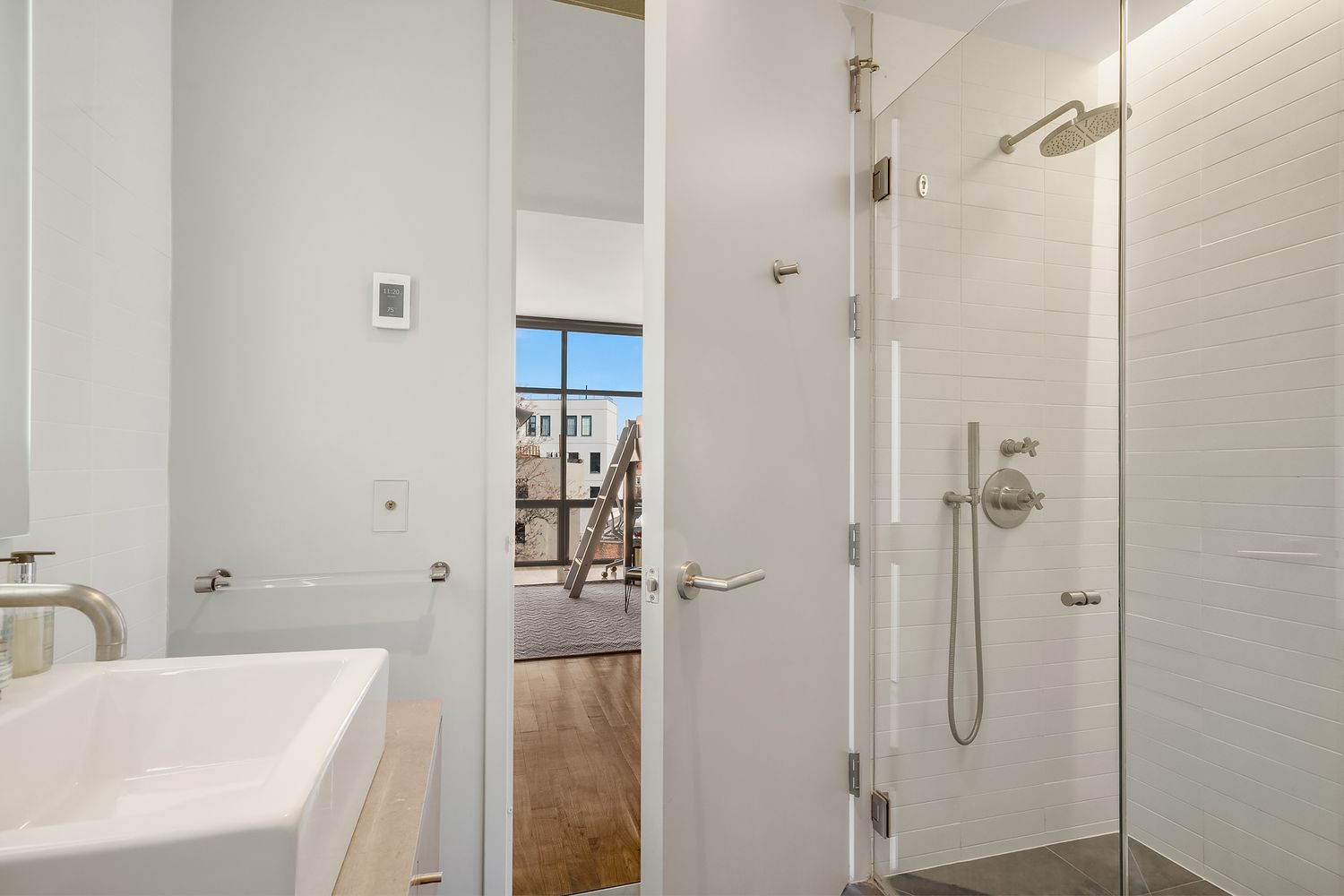 280 Metropolitan Avenue, Unit 5D Brooklyn, NY 11211 - Photo 14 of 22 a bathroom with a tub shower vanity and a sink