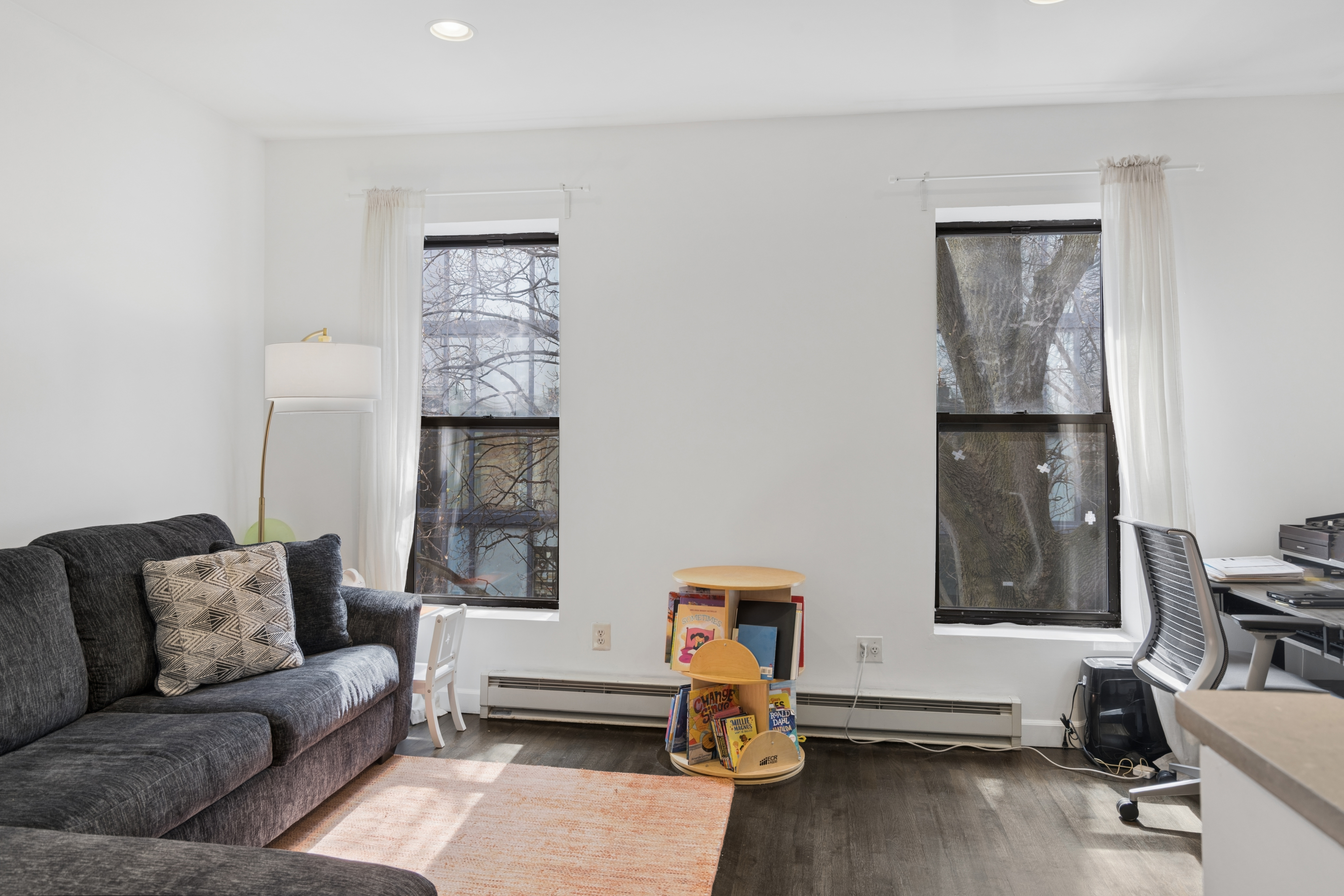 38 Halsey Street, Unit 3 Brooklyn, NY 11216 - Photo 3 of 9 a living room with furniture and a window