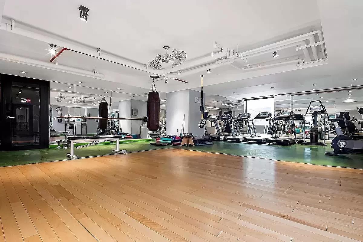 5 East 22nd Street, Unit 3N Manhattan, NY 10010 - Photo 6 of 9 a view of a room with gym equipment