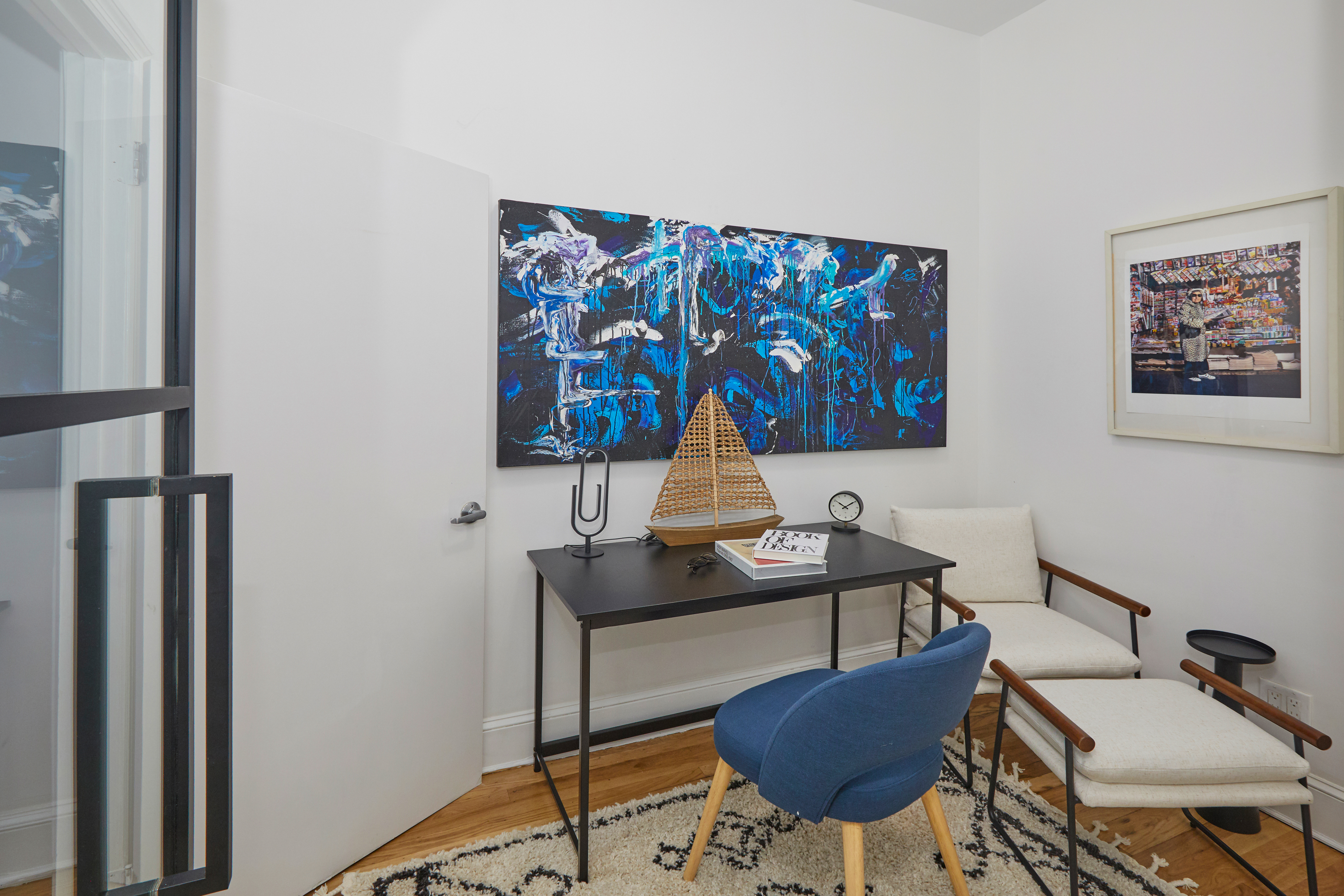 80 Leonard Street, Unit 3G Manhattan, NY 10013 - Photo 21 of 30 a workspace with furniture and wall paintings