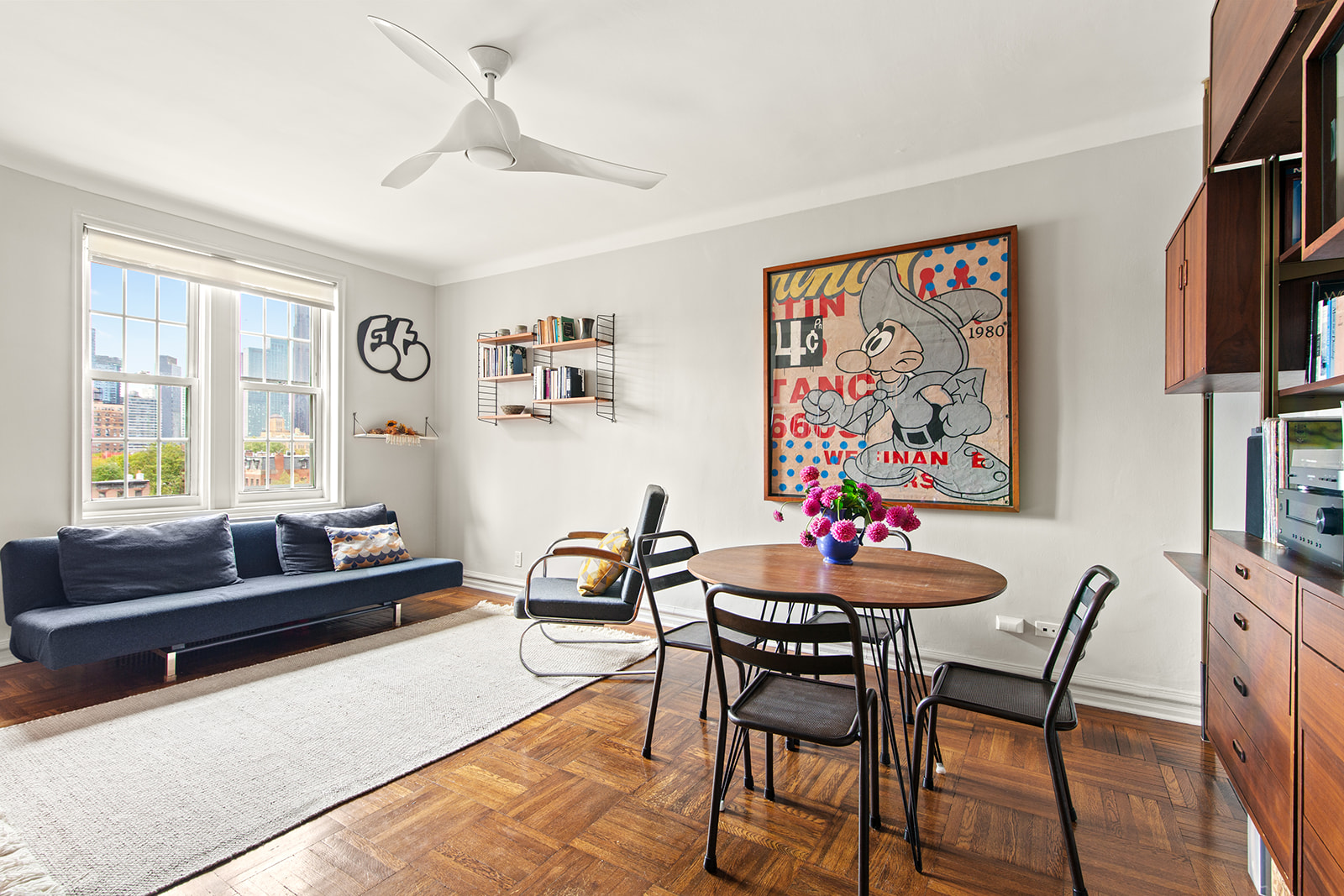 a dining room with furniture and window