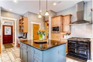 a kitchen with stainless steel appliances granite countertop a stove and a sink