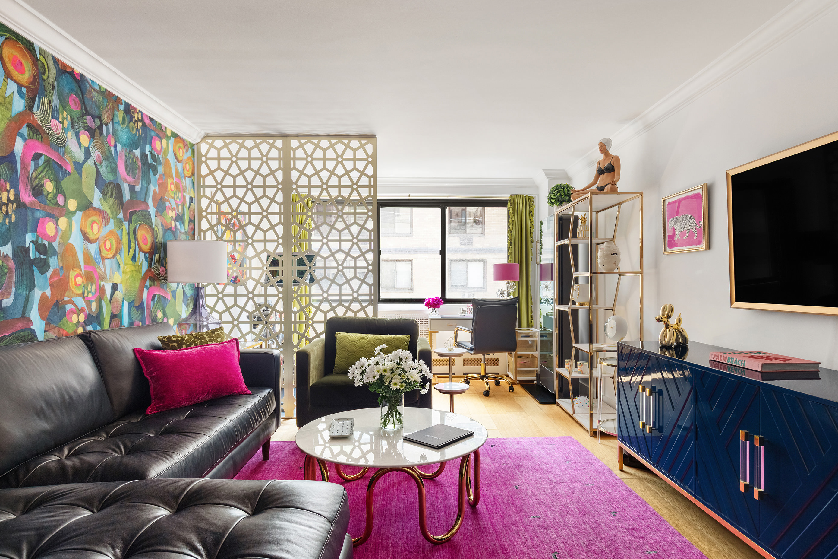 16 West 16th Street, Unit 12KN Manhattan, NY 10011 - Photo 2 of 8 a living room with furniture and a flat screen tv