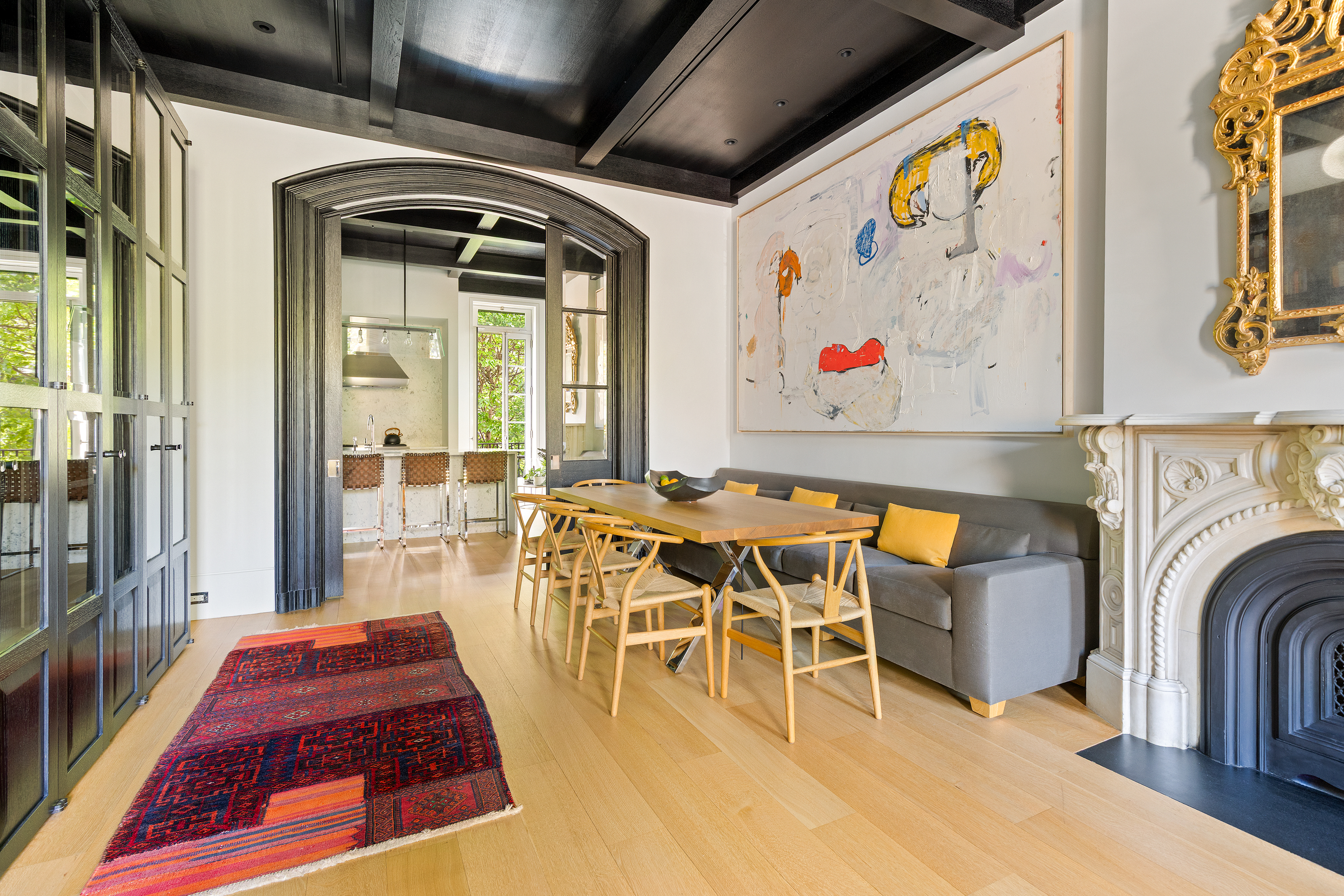 315 Adelphi Street Brooklyn, NY 11205 - Photo 4 of 31 a view of a dining room with furniture a chandelier and wooden floor