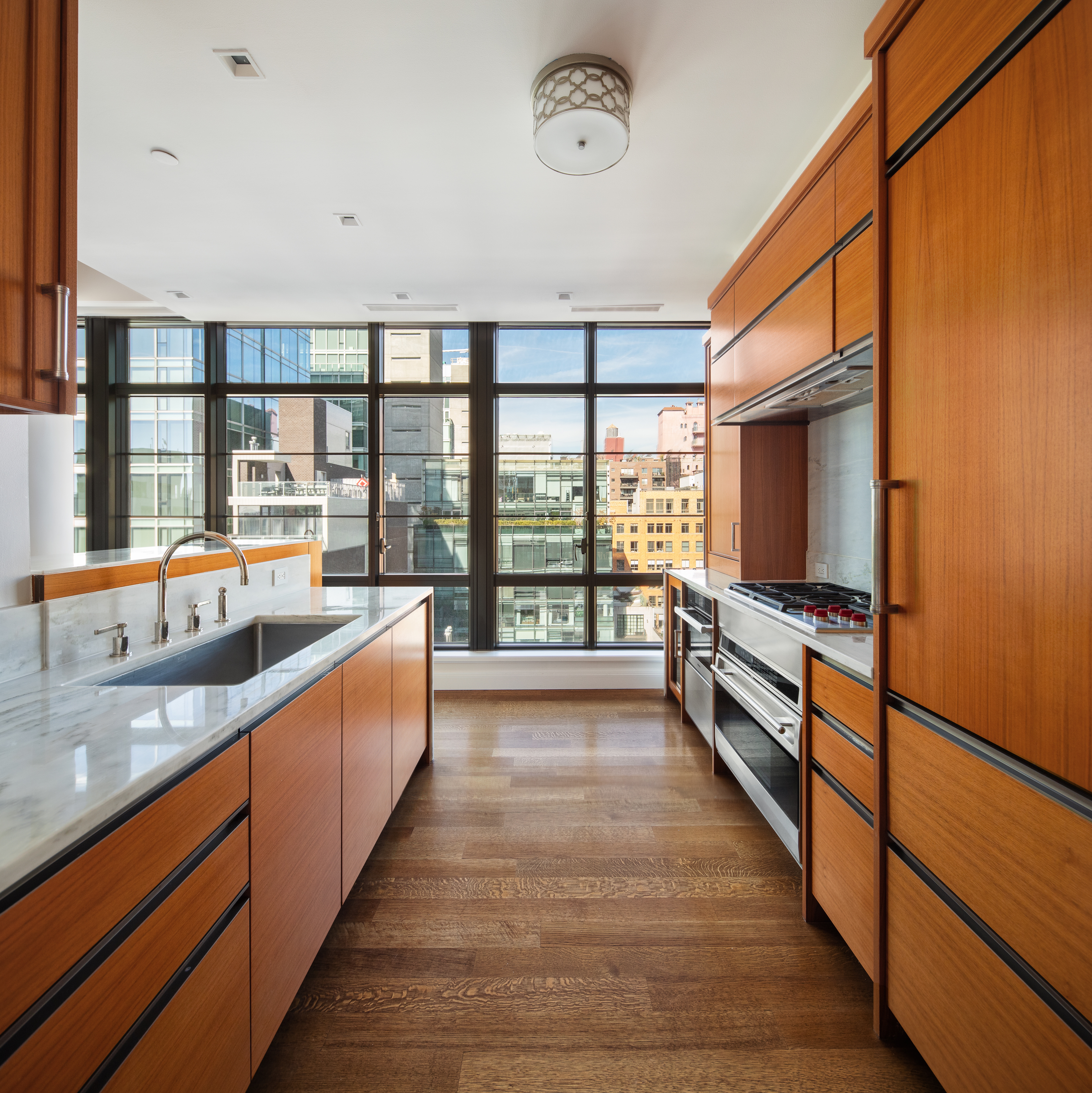 150 Charles Street, Unit 7CN Manhattan, NY 10014 - Photo 4 of 13 a view of a room with wooden floor and windows