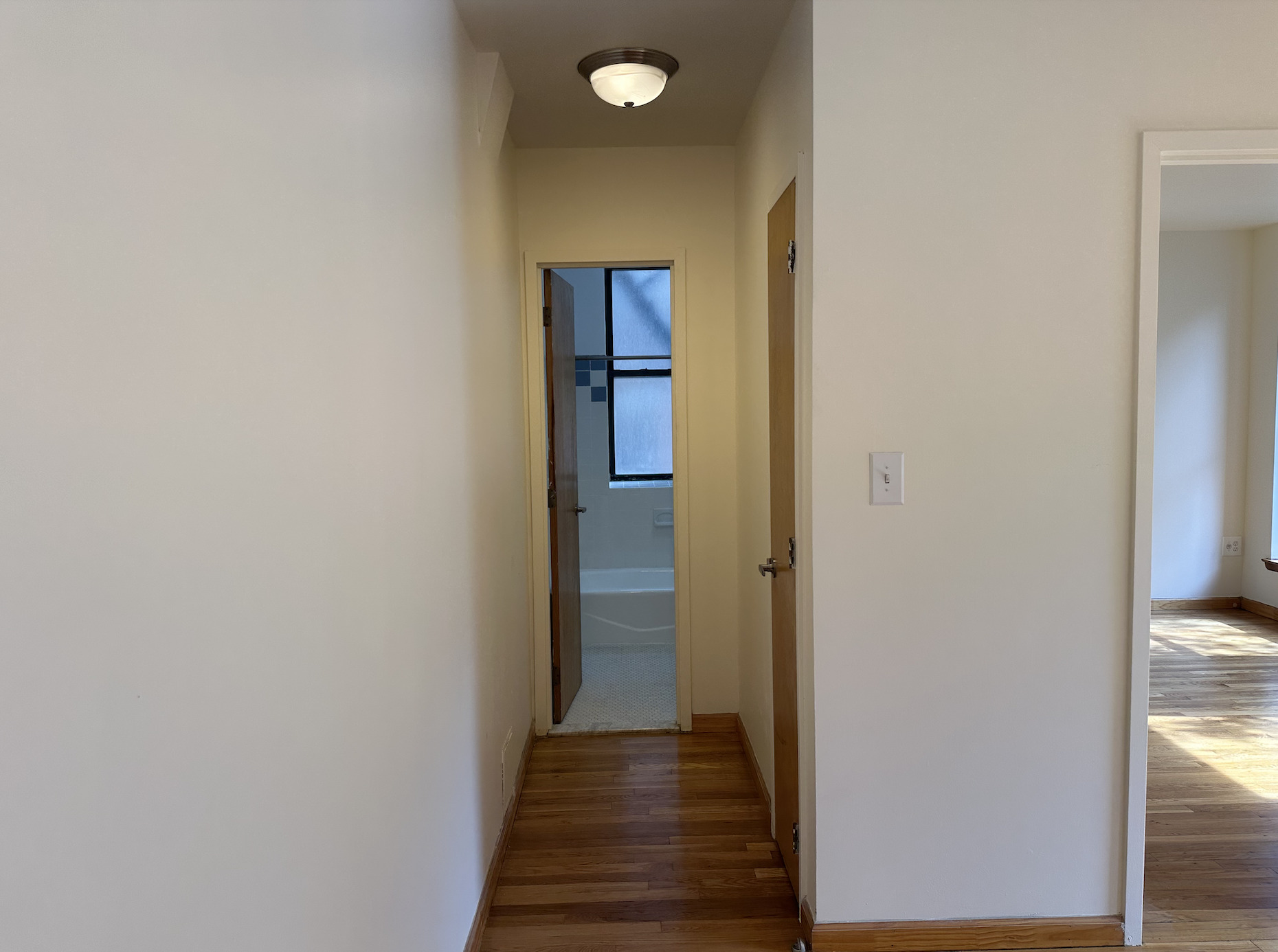 403 West 40th Street, Unit 2FE Manhattan, NY 10018 - Photo 10 of 12 a view of a hallway with wooden floor and staircase