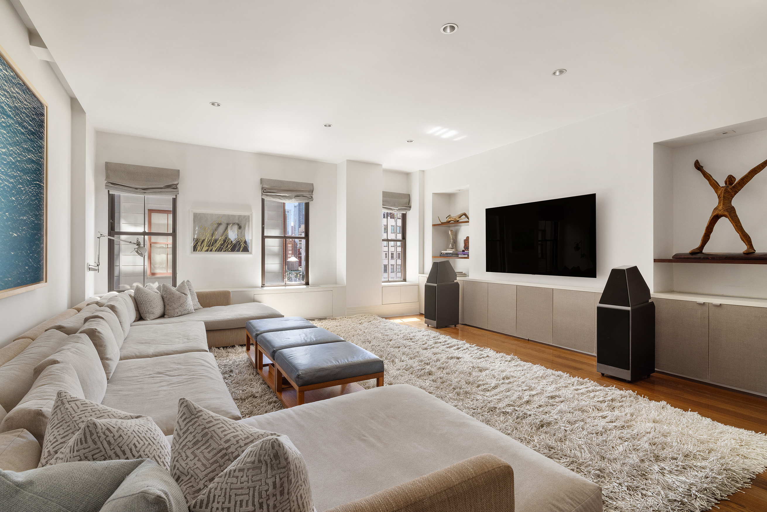 27 North Moore Street, Unit 10D Manhattan, NY 10013 - Photo 9 of 30 a living room with furniture and a flat screen tv