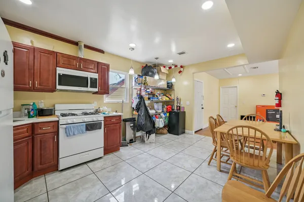 a kitchen with a stove a sink and a refrigerator