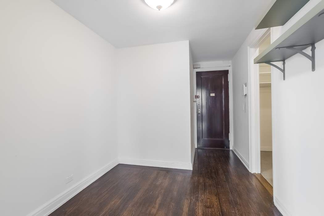 340 West 57th Street, Unit 14E Manhattan, NY 10019 - Photo 8 of 13 a view of hallway with wooden floor