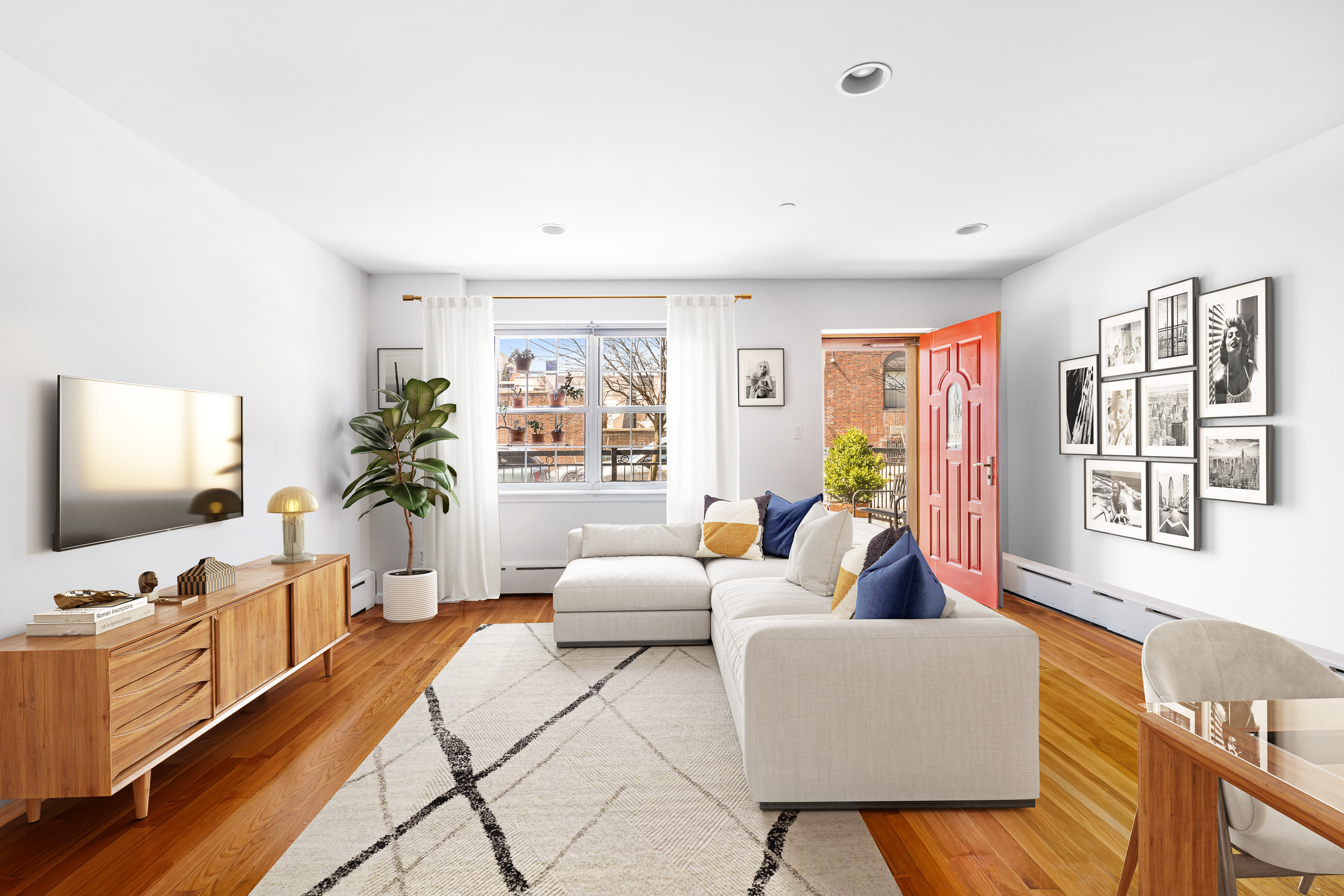 26 Monitor Street, Unit 1 Brooklyn, NY 11222 - Photo 2 of 11 a living room with furniture and a flat screen tv