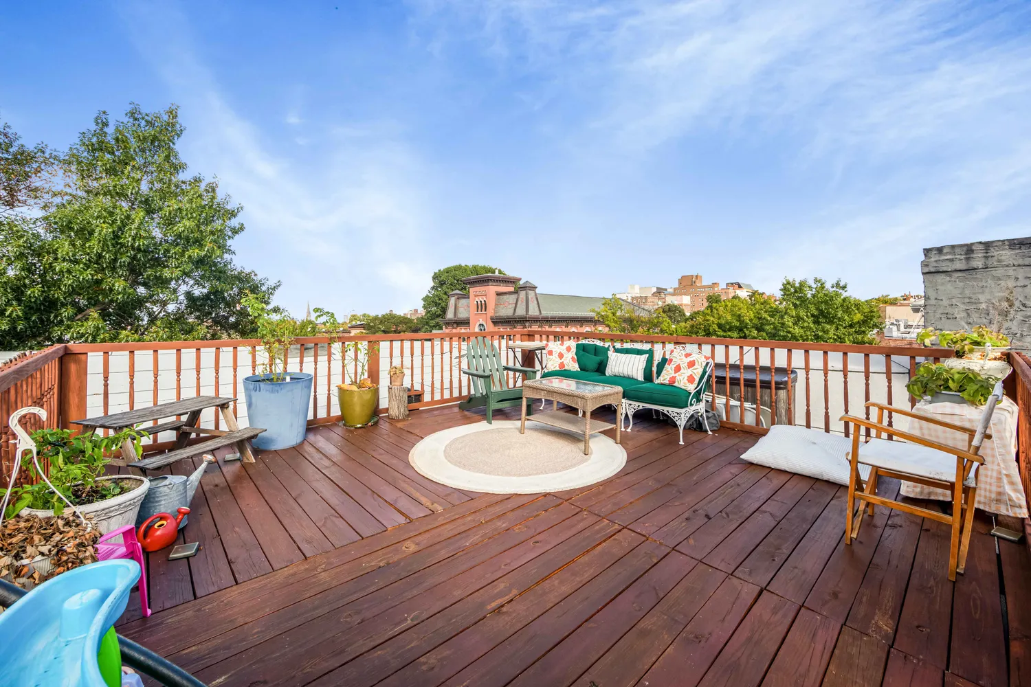 a balcony with wooden floor and fence