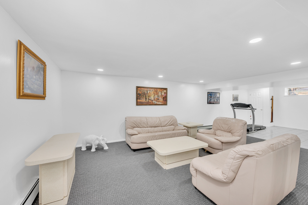 35 Poe Street Staten Island, NY 10307 - Photo 25 of 36 a living room with furniture and a lamp