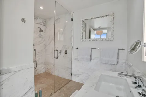a bathroom with a bathtub and a shower