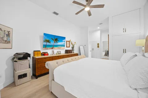 a bedroom with a bed and dresser