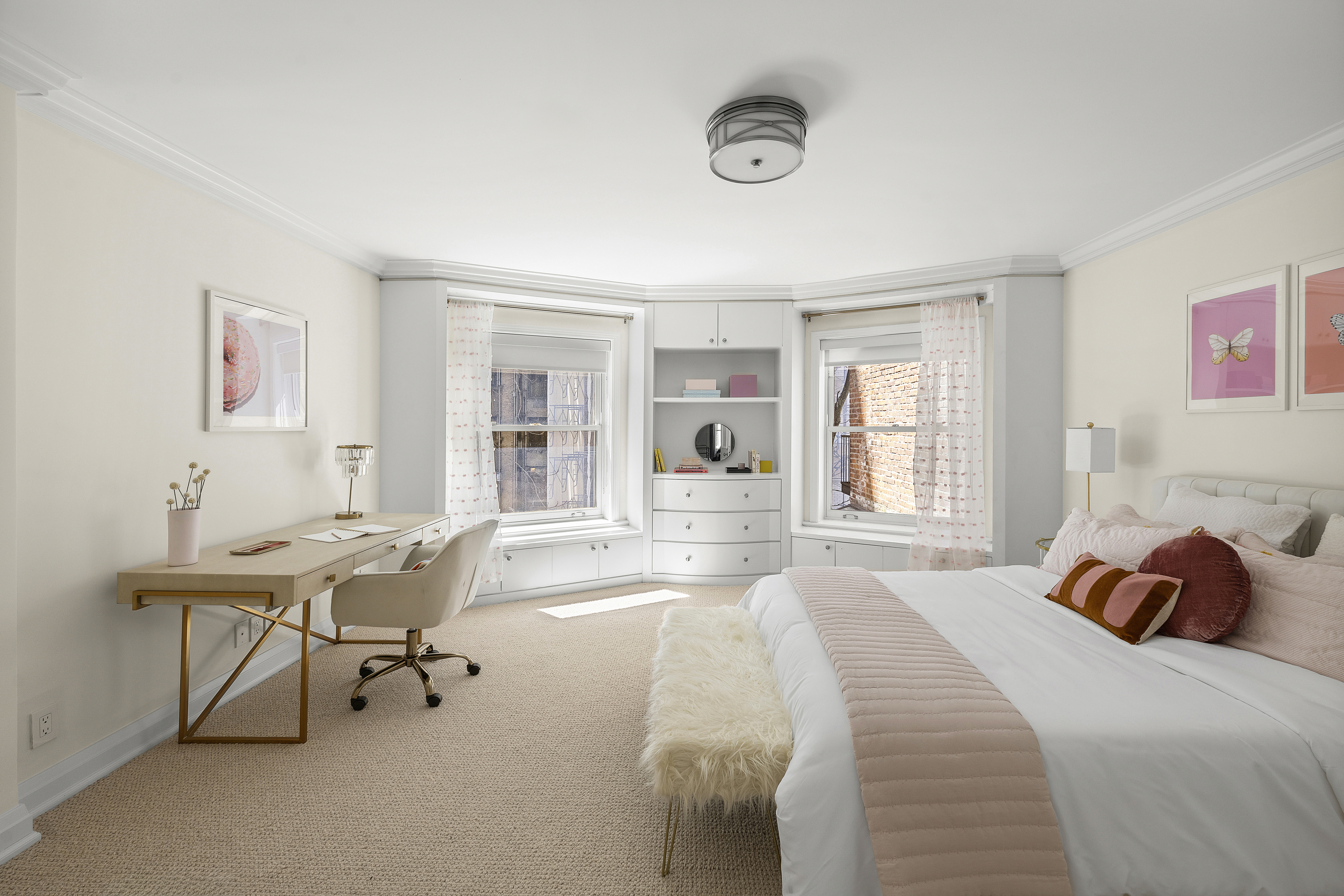 50 East 73rd Street Manhattan, NY 10021 - Photo 22 of 32 a bed room with a bed and a table chair