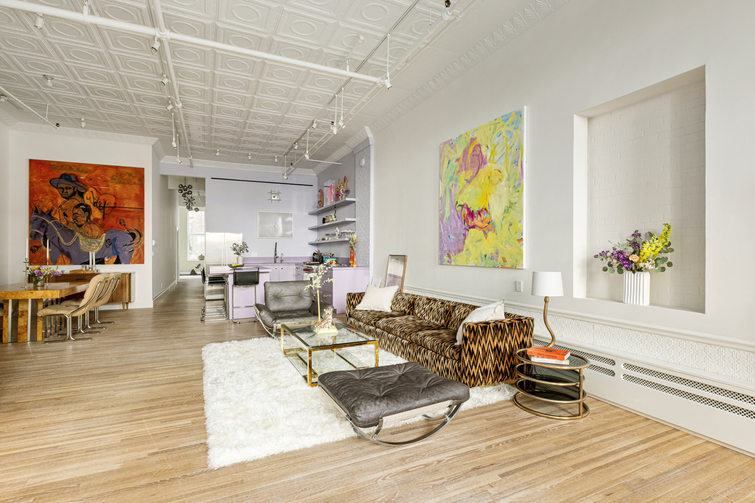 55 Walker Street, Unit 3A Manhattan, NY 10013 - Photo 2 of 12 a living room with furniture and painting on the wall with wooden floor